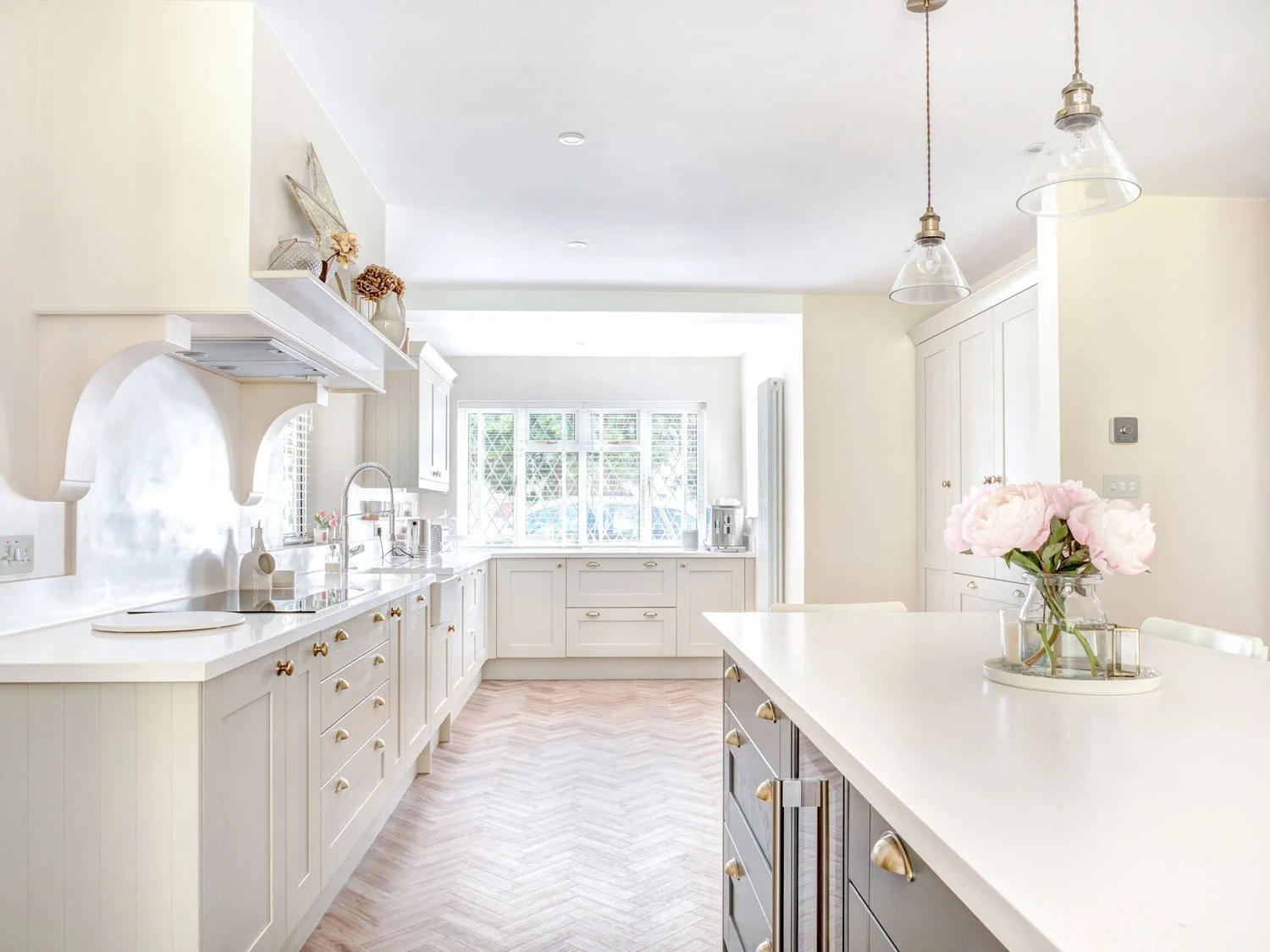 A large downstairs kitchen conversion of a detached house bringing together a kitchen and dining room and creating a utility and cloakroom in Steyning, West Sussex.