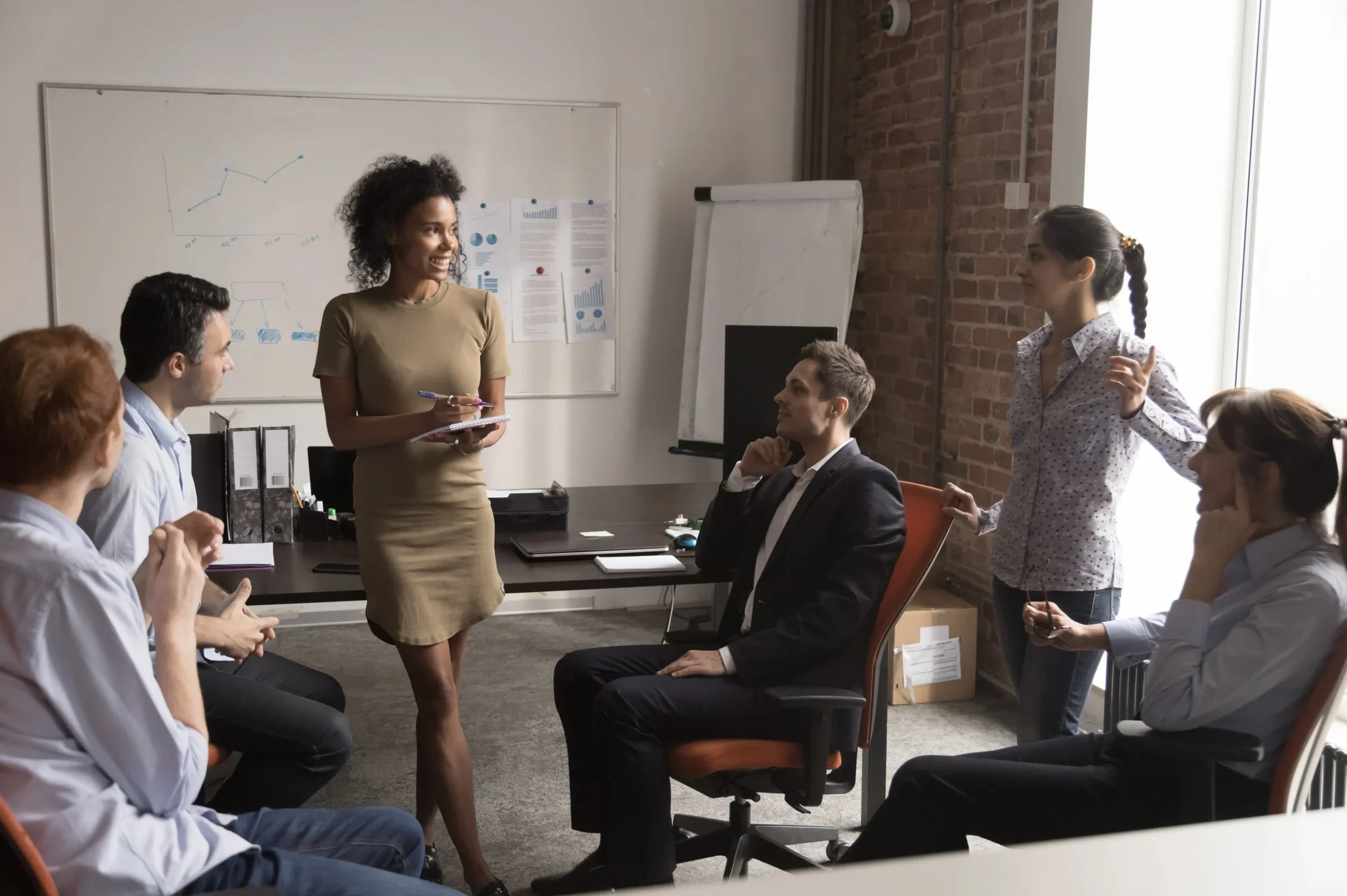 A picture of 6 people working as a team of coaches