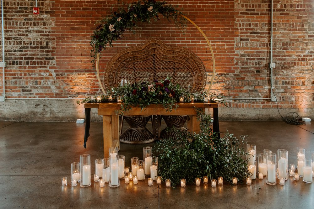 isabel and garrett indianaolsi wedding head table rustic moody red florals with greenery.jpg