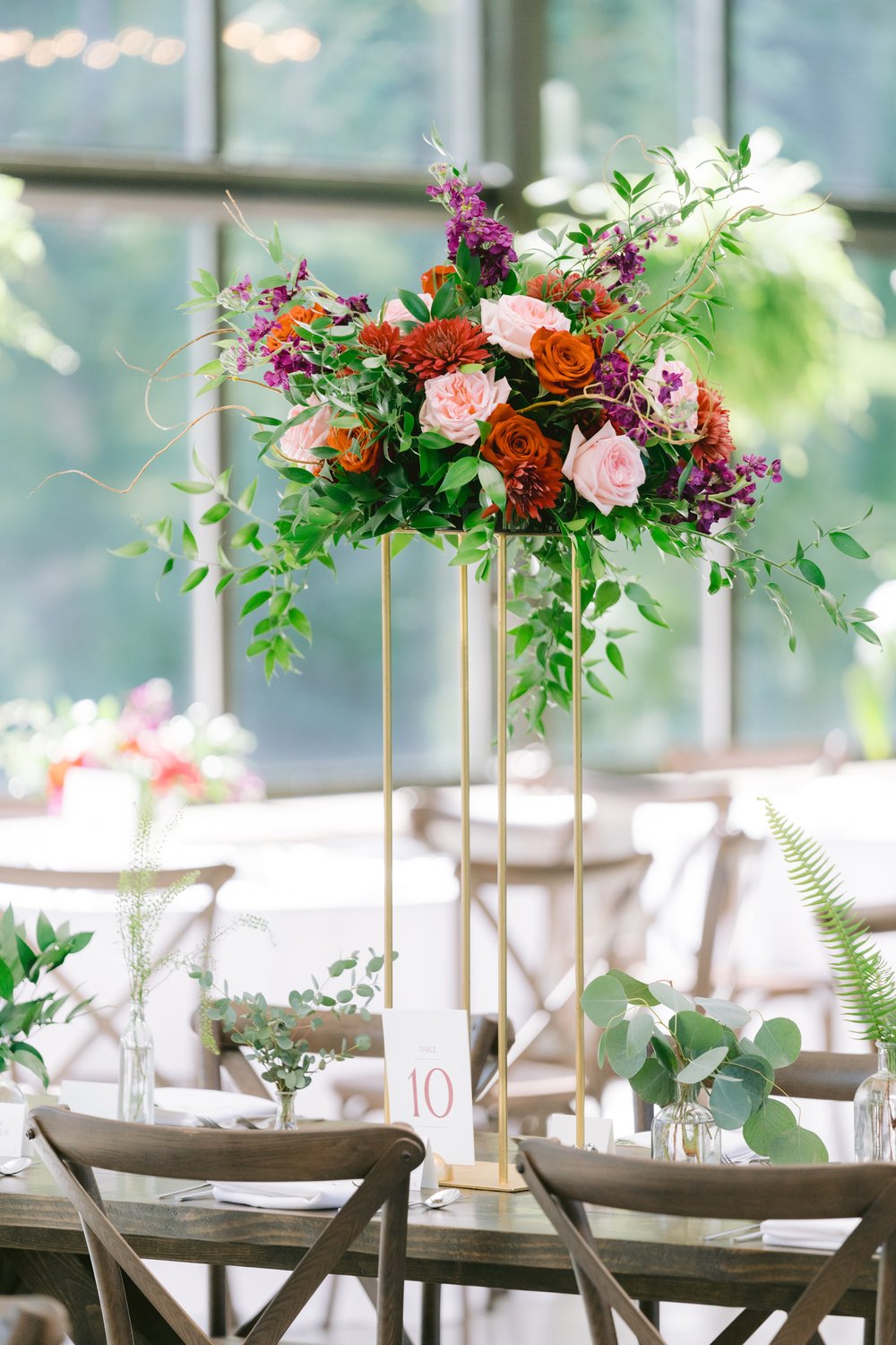 Anita Travis Trivedi Wedding beautiful tall wedding reception centerpiece floral bouquet pink red and greenery.jpg