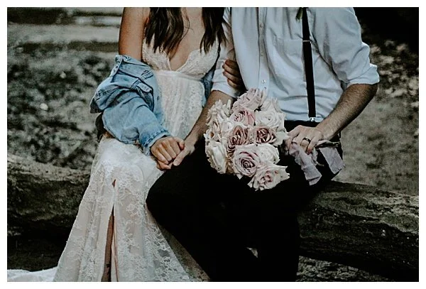 bride and groom bouquet sitting outside