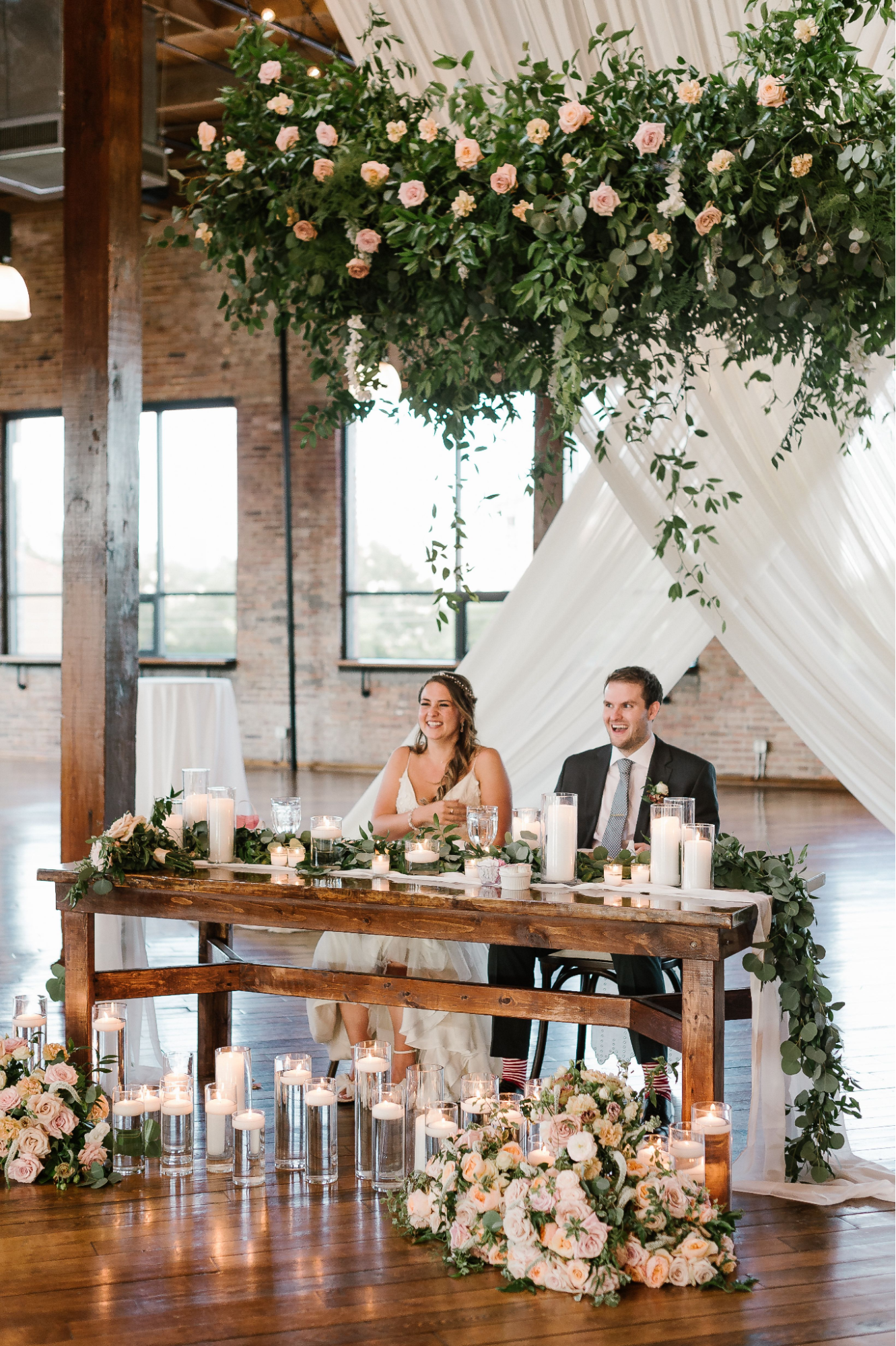 pretty wedding head table florals.png