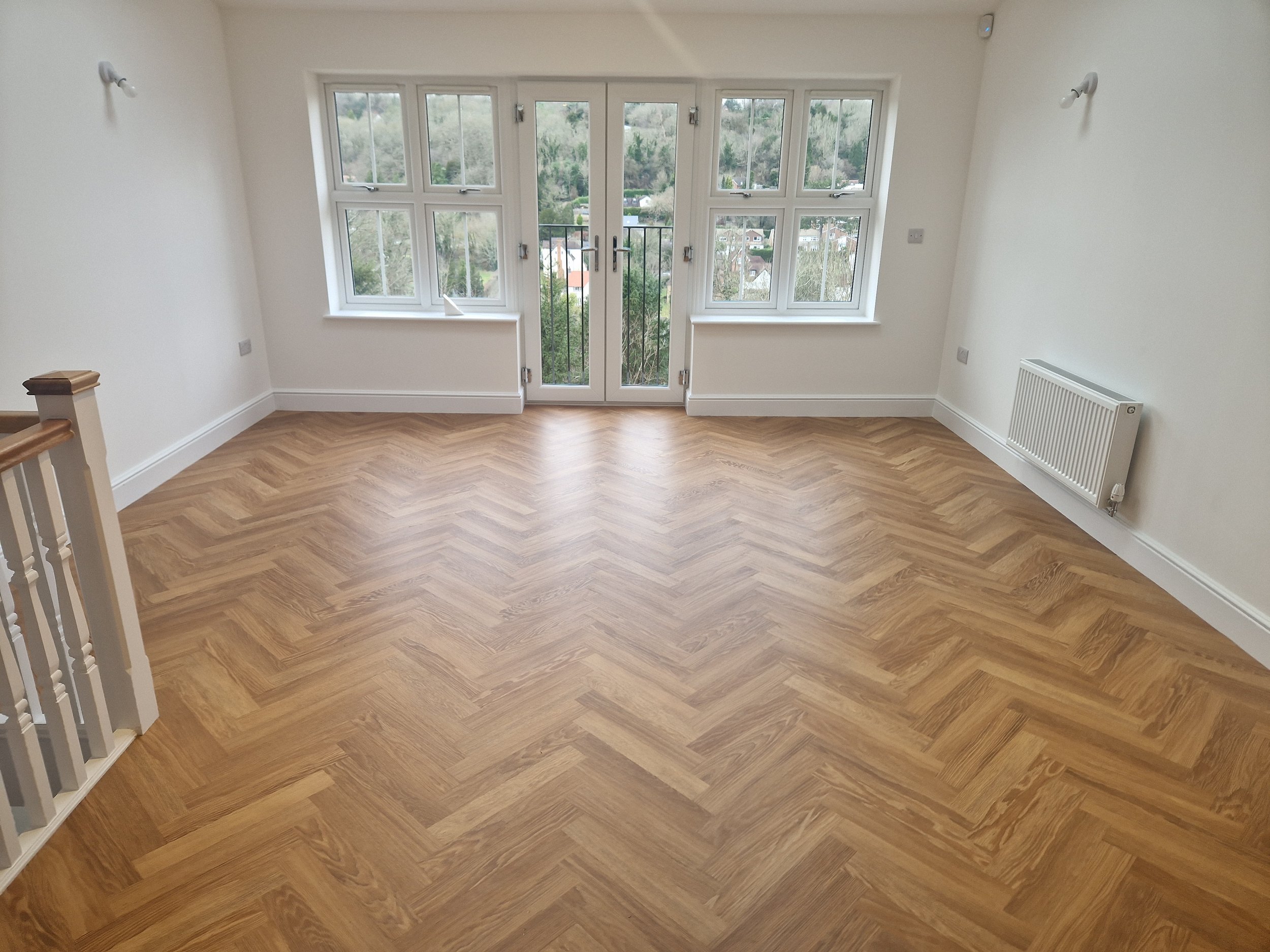 Wood effect LVT flooring fitted in a modern new build property in caterham , surrey, UK