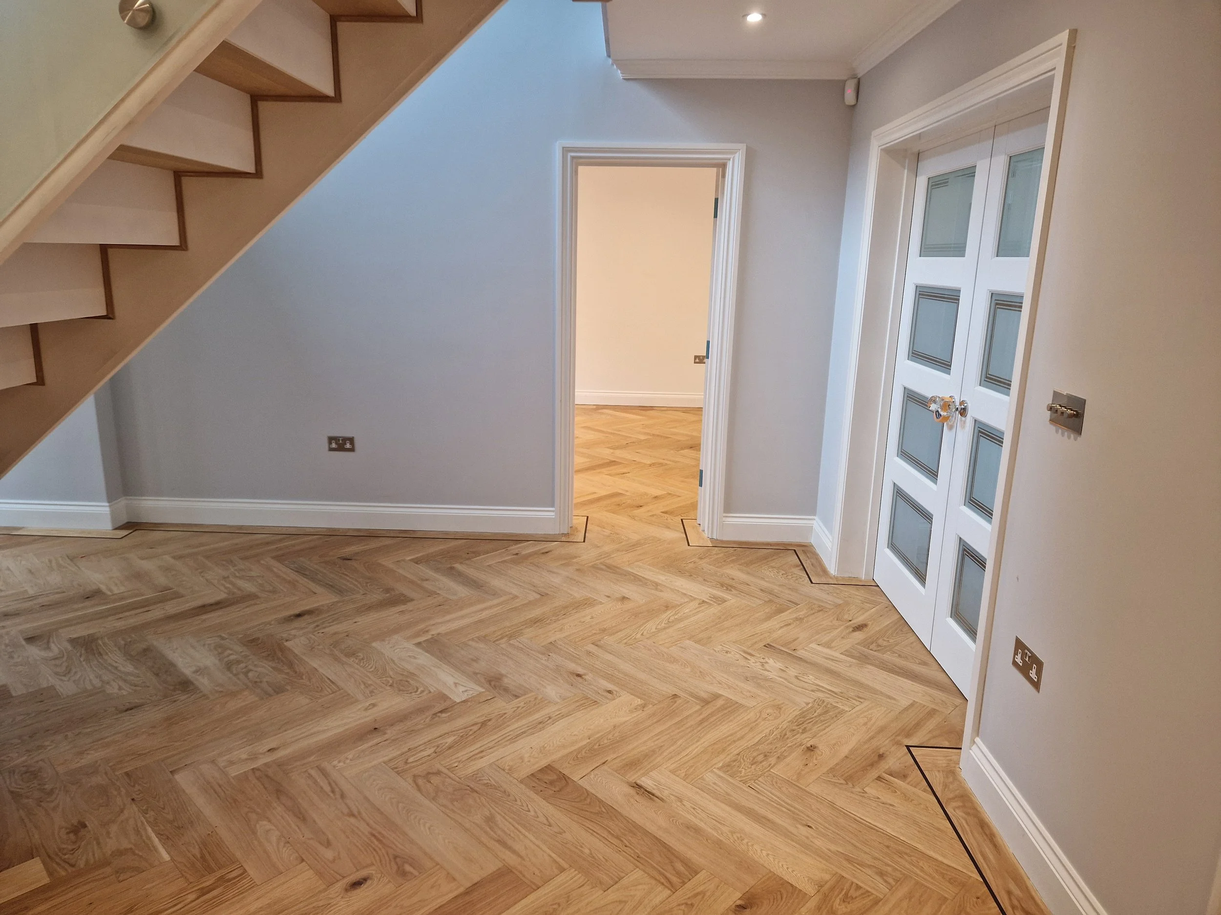 Smoked herringbone oak parquet flooring installed in a west london home renovation
