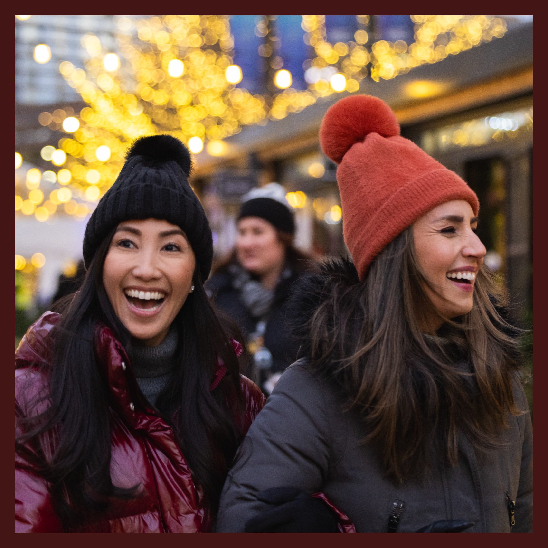 Two women enjoying the Downtown Detroit Holiday Markets in downtown Detroit.