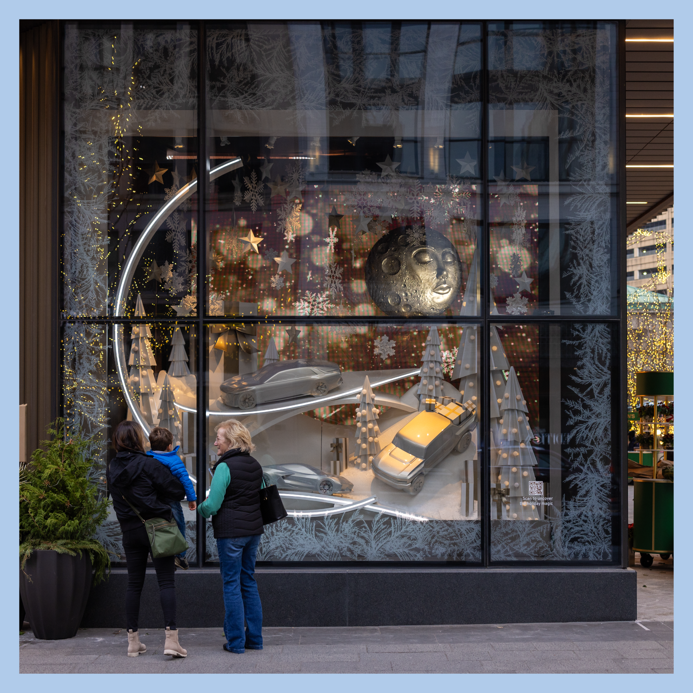 Two women looking at a holiday window display at Hudson's Detroit.