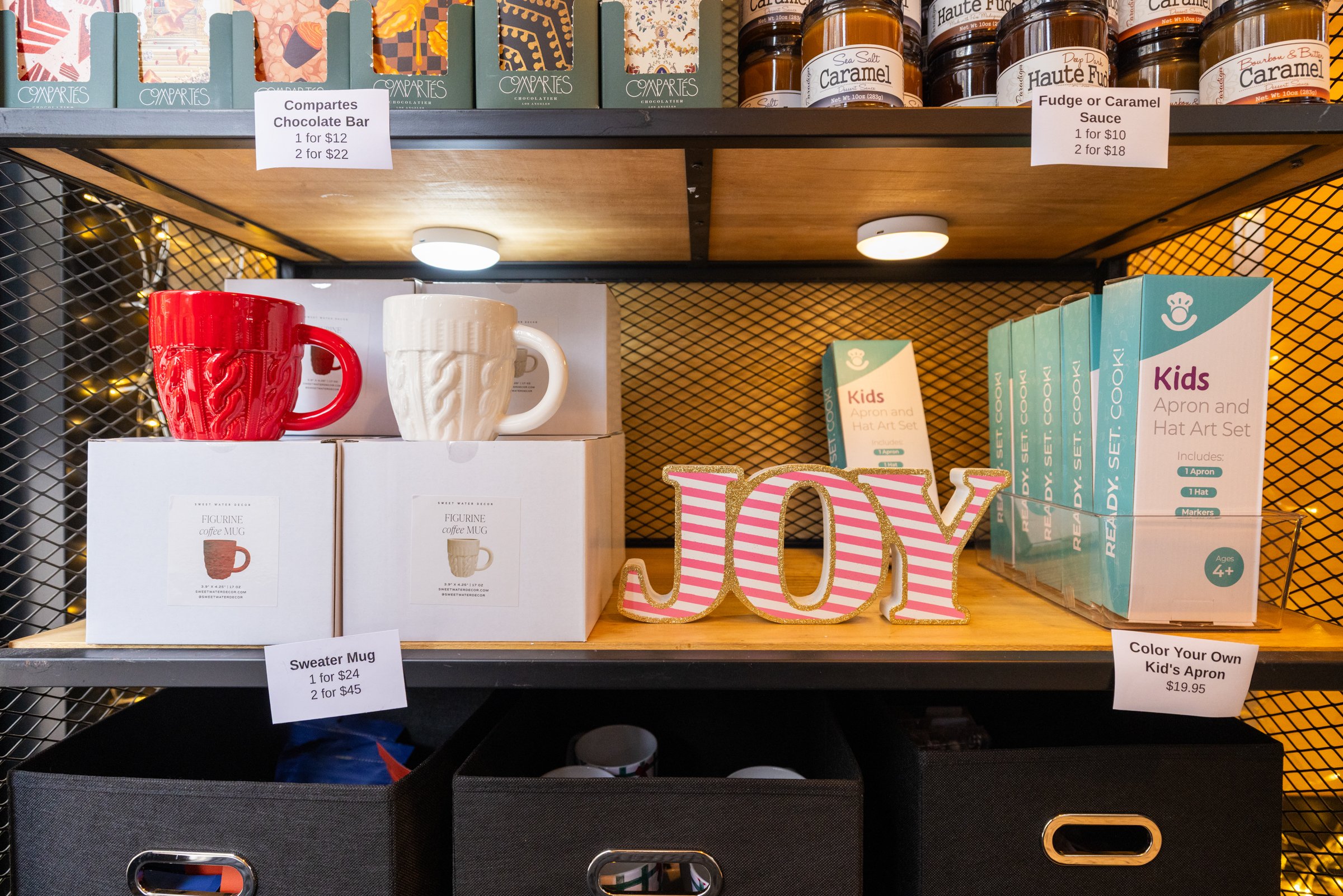 Product photo of mugs, food sauces, and other merchandise from BrownieDoctor at the Holiday Markets in Cadillac Square, downtown Detroit.