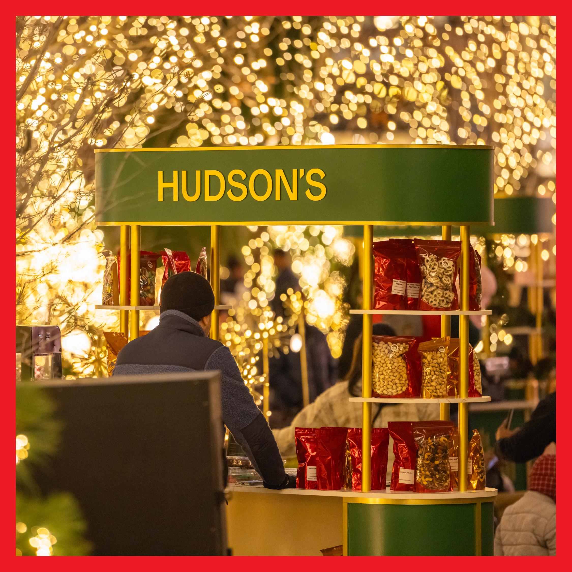 A patron at a Hudson's merchant booth at Nick Gilbert Way.
