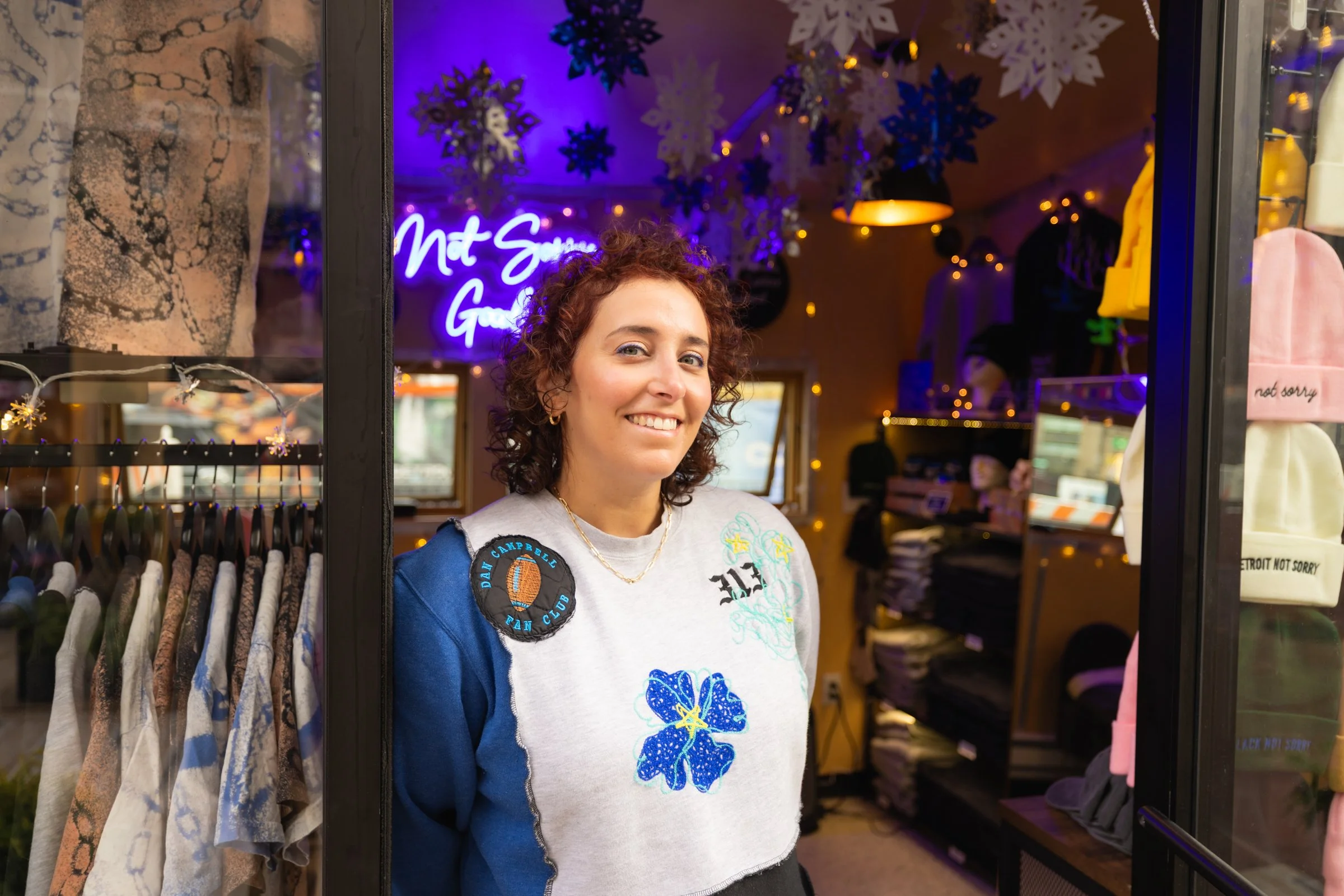 Exterior photo of the owner of Not Sorry Goods at the Holiday Markets in Cadillac Square, downtown Detroit.