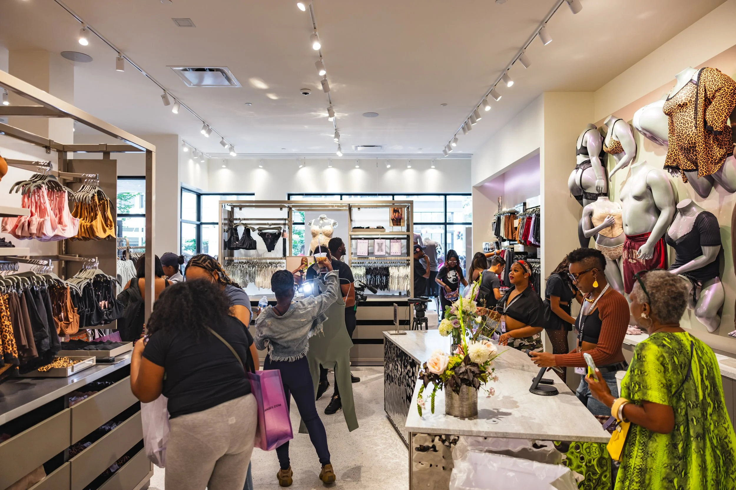 Shoppers and employees at Savage X Fenty in Detroit.