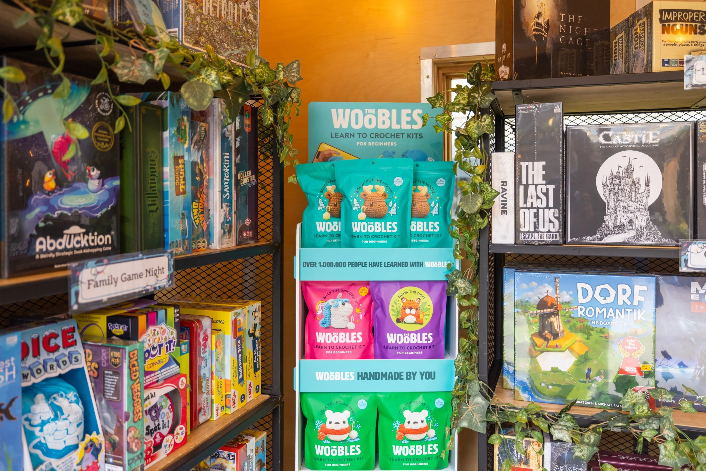 Product photo from Opal Grove Games at the Holiday Markets at Cadillac Square, downtown Detroit. Featuring various board games and an endcap of crocket kits.