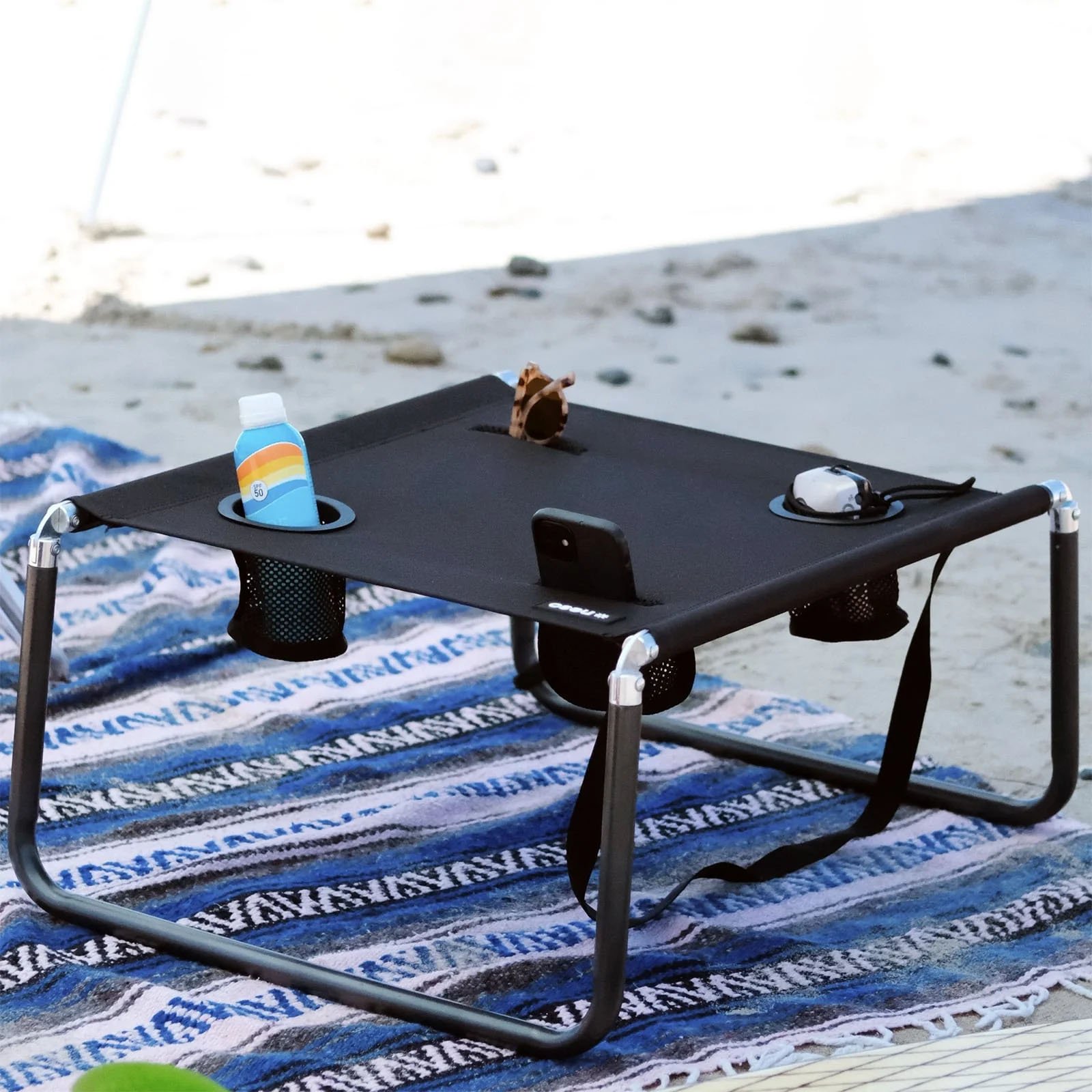 Black-table-on-beach-min.jpg