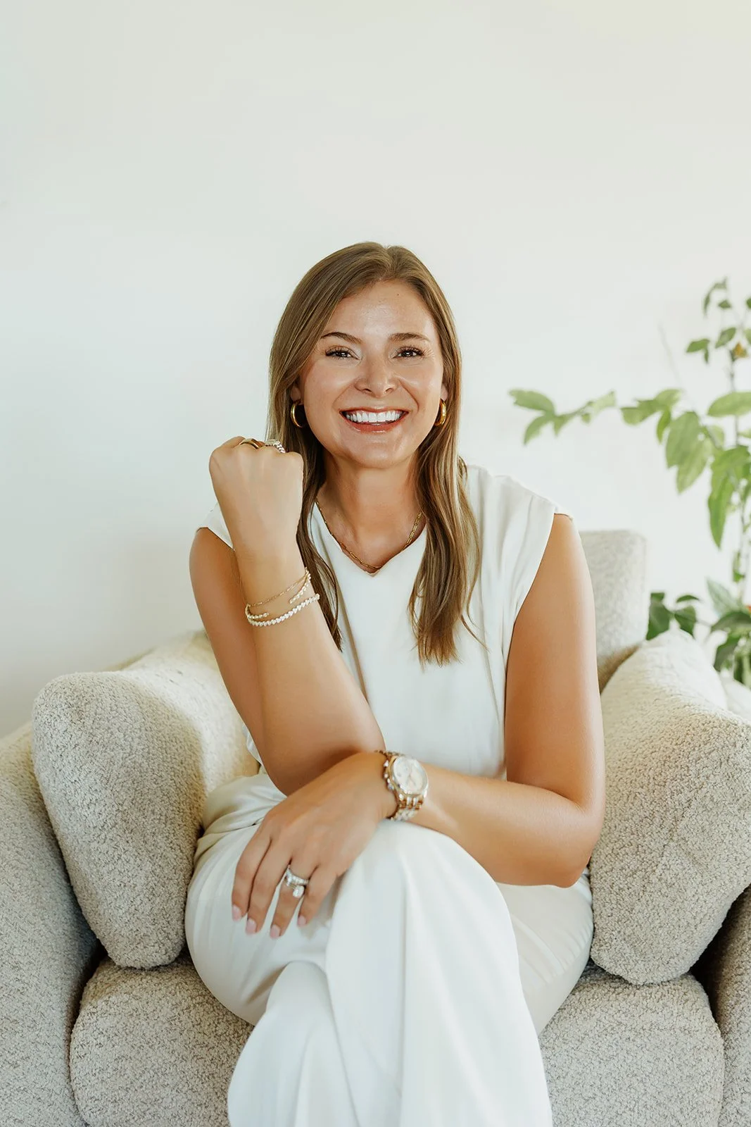 Kerri Roberts sitting in a chair smiling