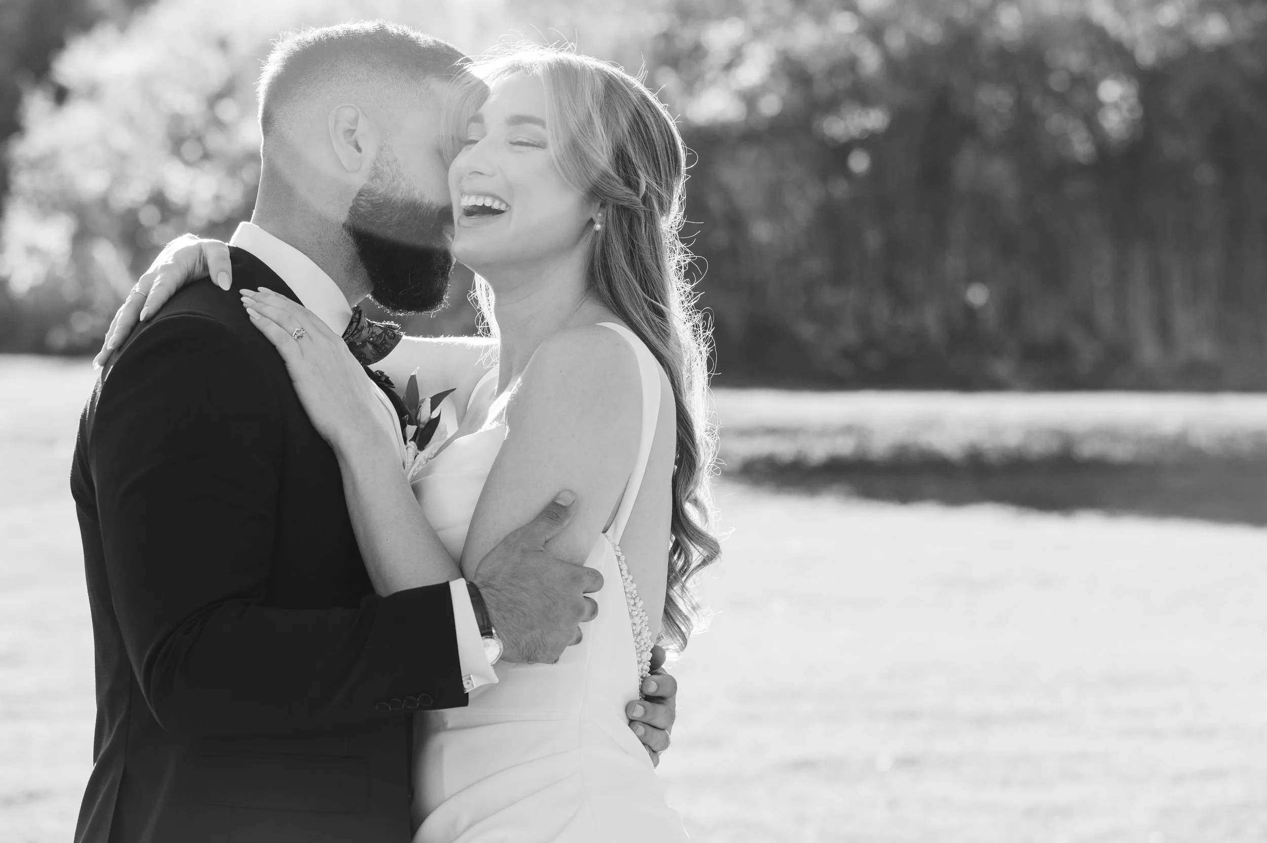 Happy bride embracing the groom at The Vue clubhouse and event space in Etobicoke, Ontario.