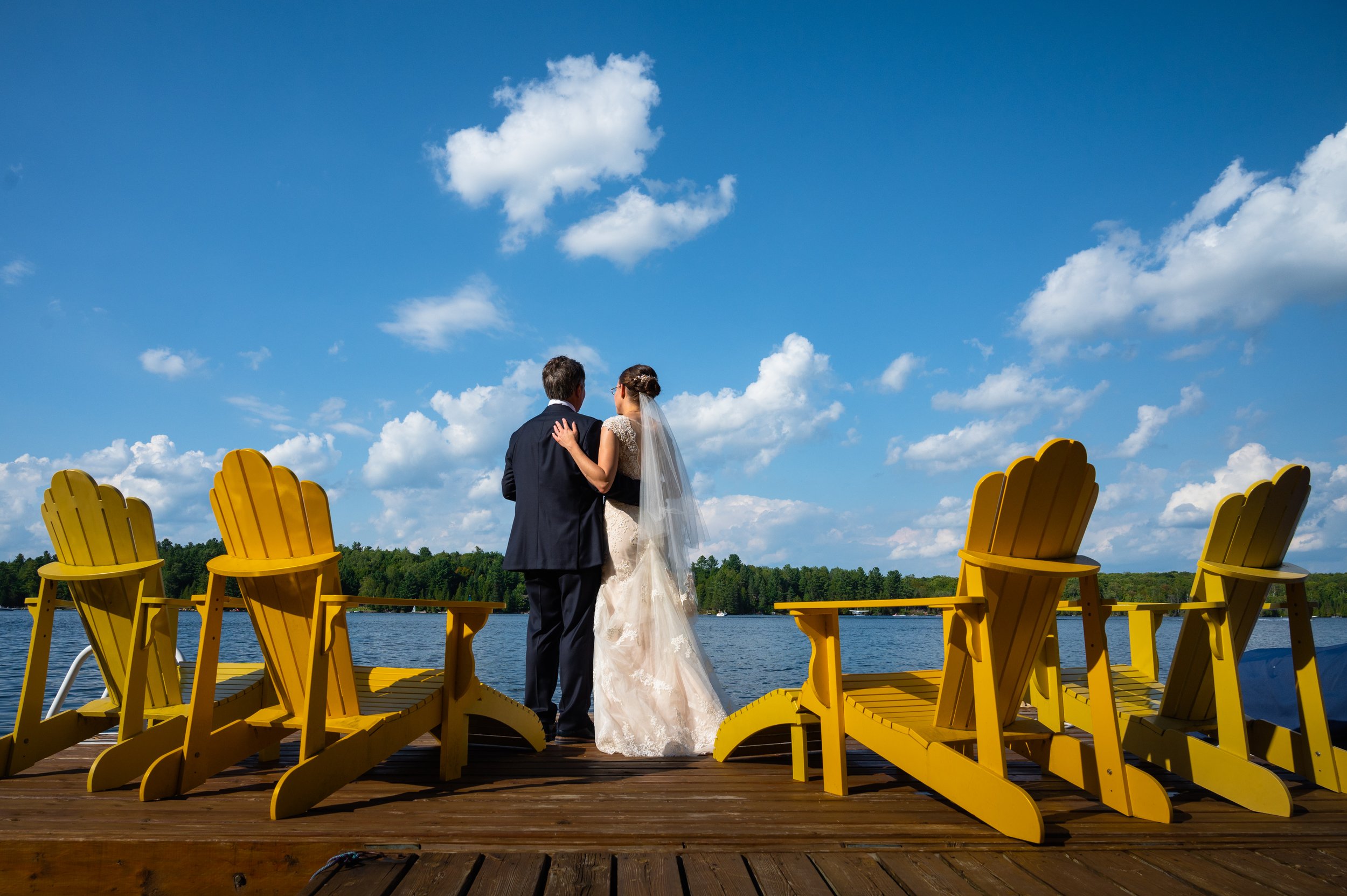 Cottage wedding with bride and groom overlooking the water