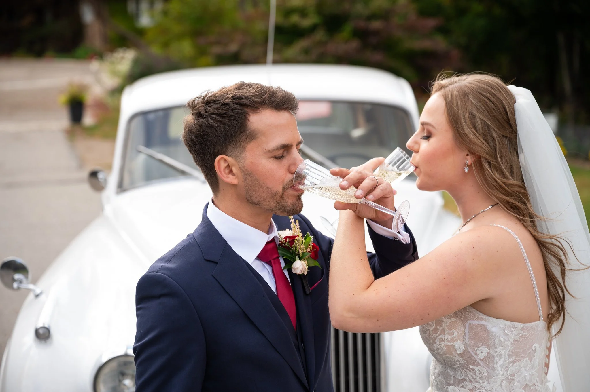 Bride and groom sharing a champagne toast during their Mississauga wedding.