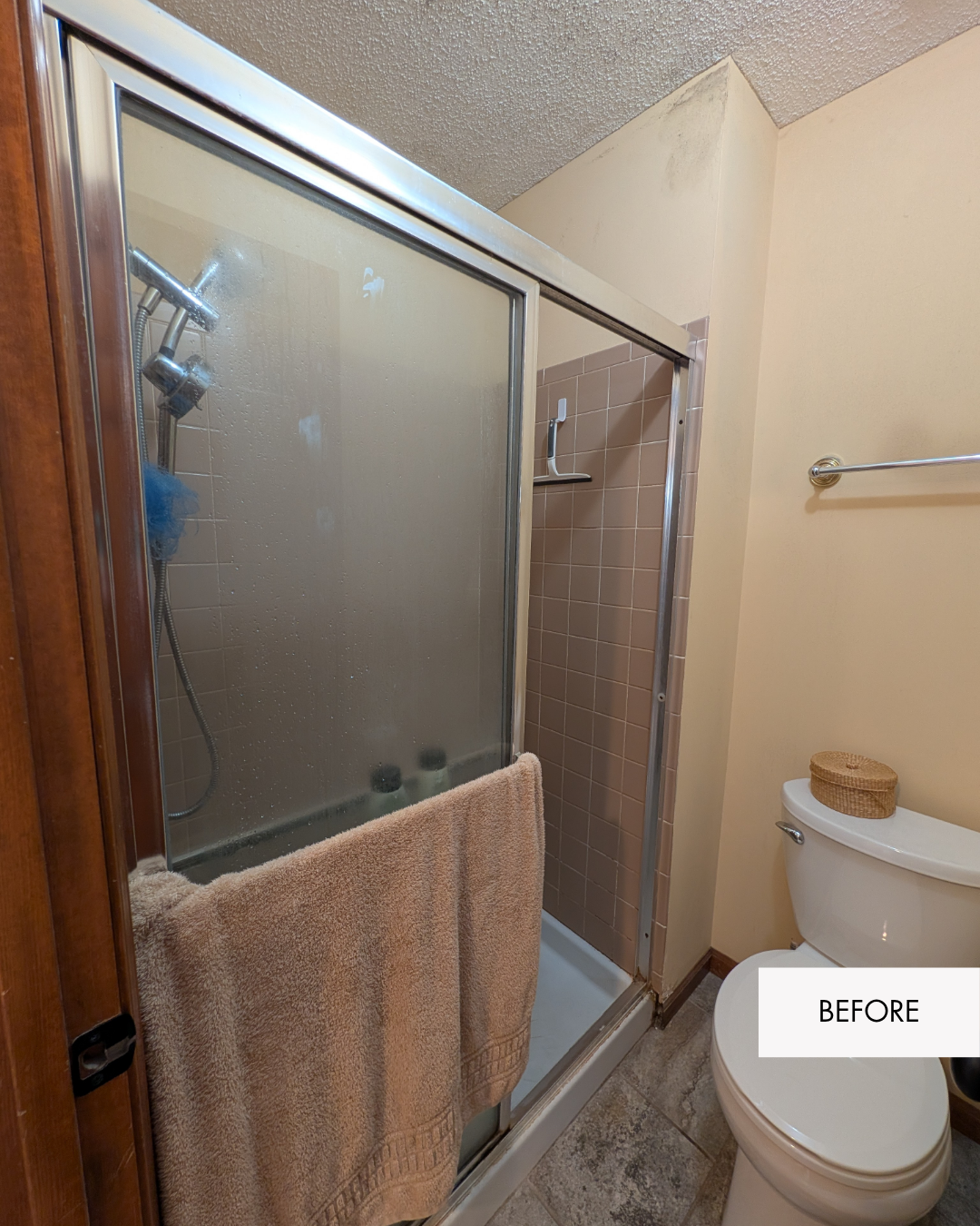 Small shower and toilet room before remodel with a cramped layout, limited privacy and moisture concerns