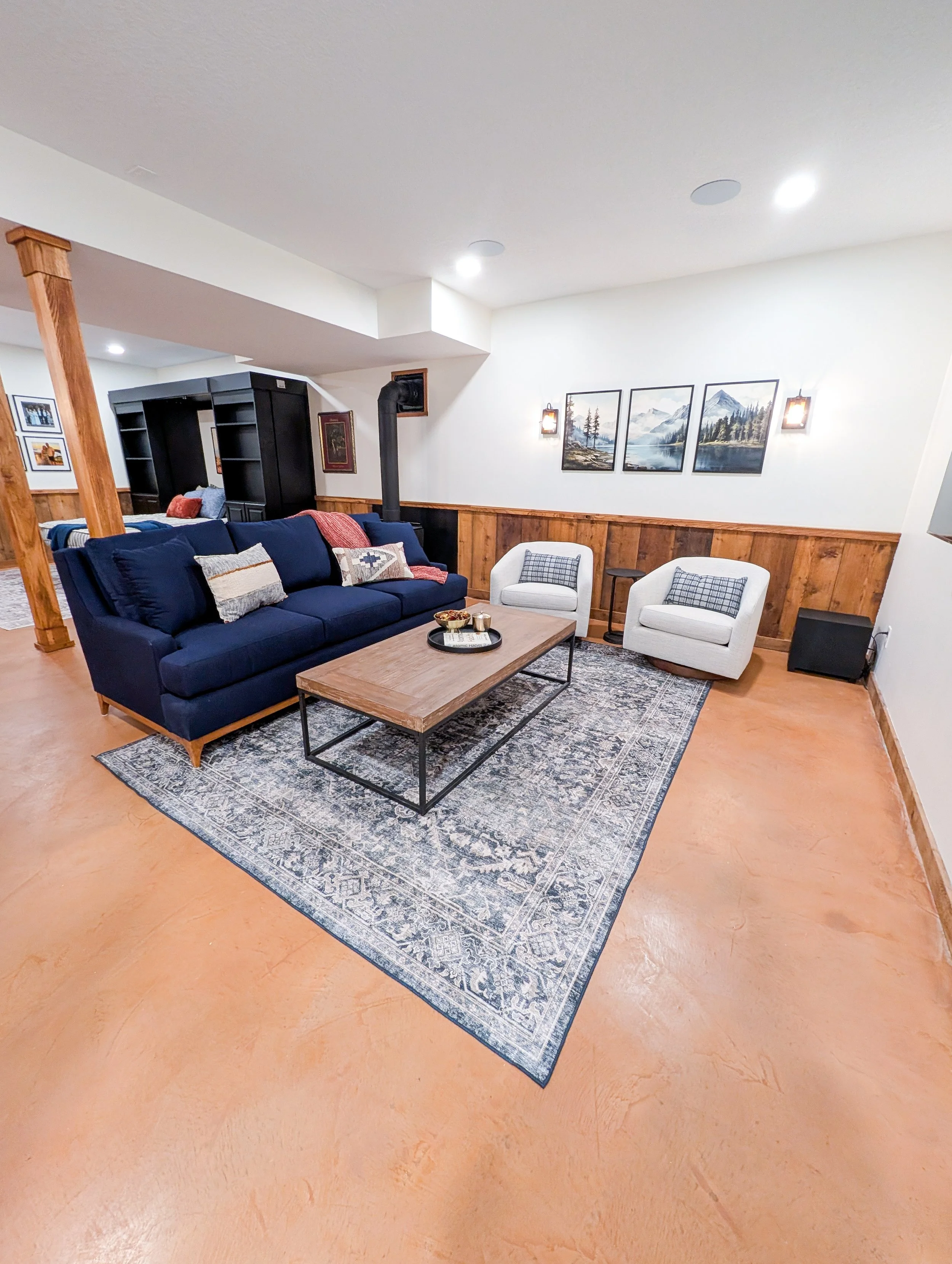 Finished modern cabin basement remodel in Grain Valley Missouri with concrete overlay flooring and custom details