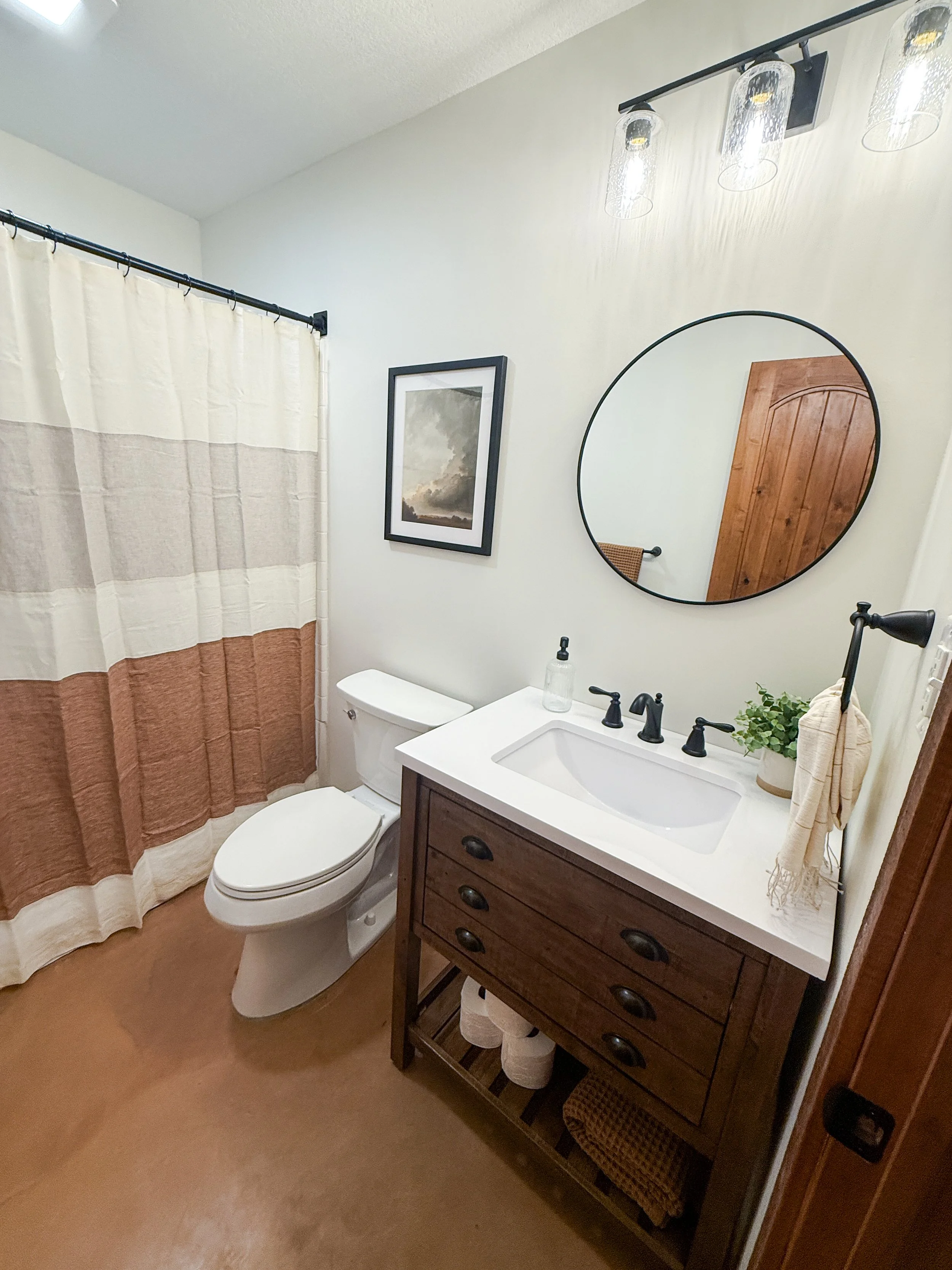 Remodeled basement bathroom in Grain Valley MO with updated finishes and modern cabin style