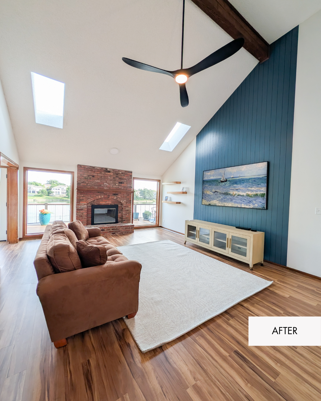 Living room remodel with blue accent wall for tv feature, contemporary new black fan and floating shelves