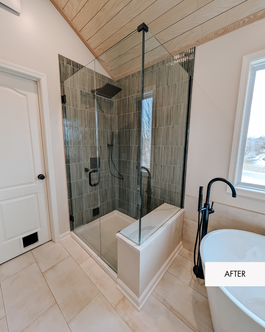 After photo of sage green vertical tile shower with frameless glass enclosure
