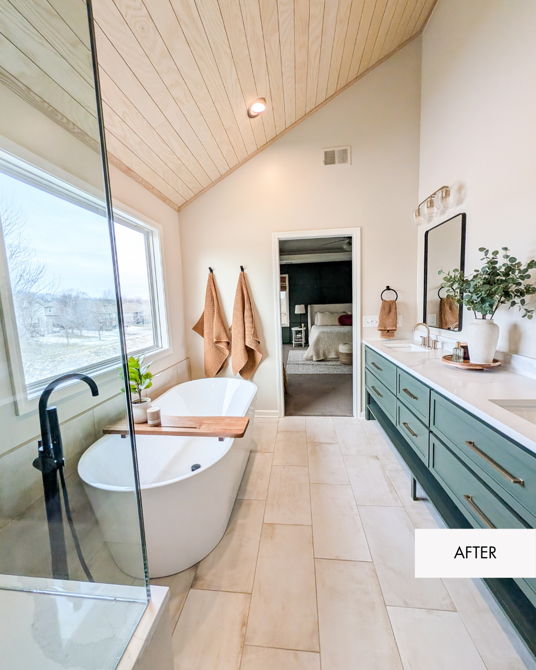 After photo of a bathroom with a sage green vanity and a freestanding tub