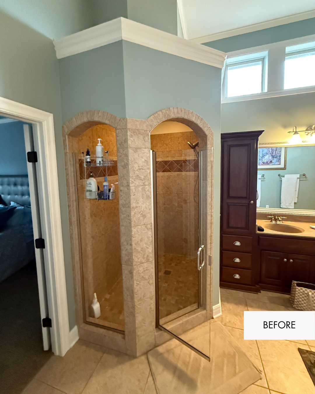 Before photo of enclosed primary bathroom shower with arched tile surround