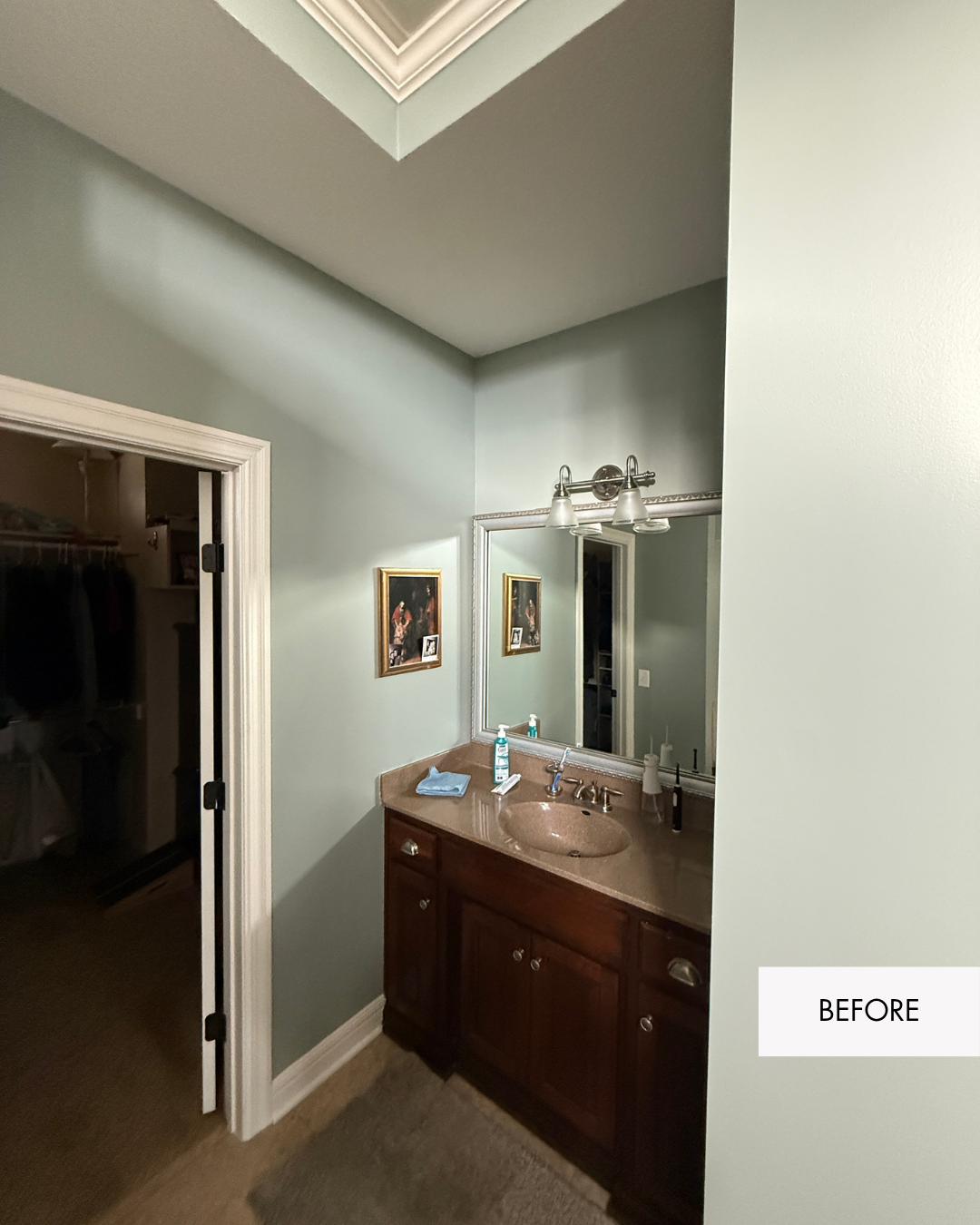 Before photo of small separate vanity near the primary closet