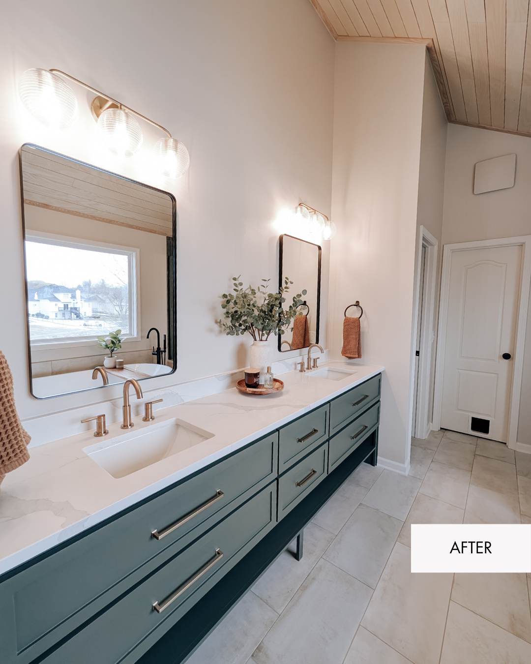 After photo of custom sage green bathroom vanity with brass fixtures and quartz countertop