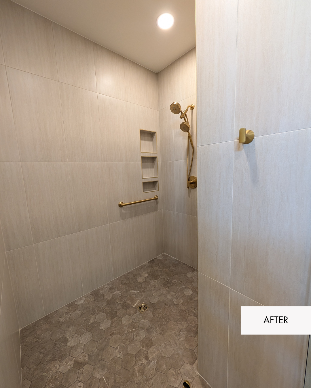 Walk-in shower with large format tile, hexagon floor tile, brushed gold fixtures and built-in niches