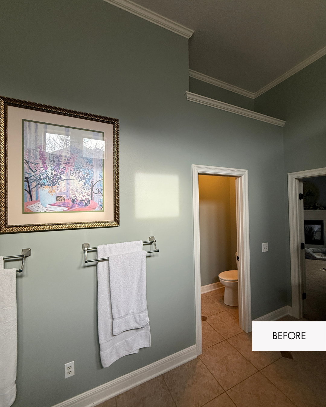 Before photo of enclosed water closet with green walls and overhead shelf