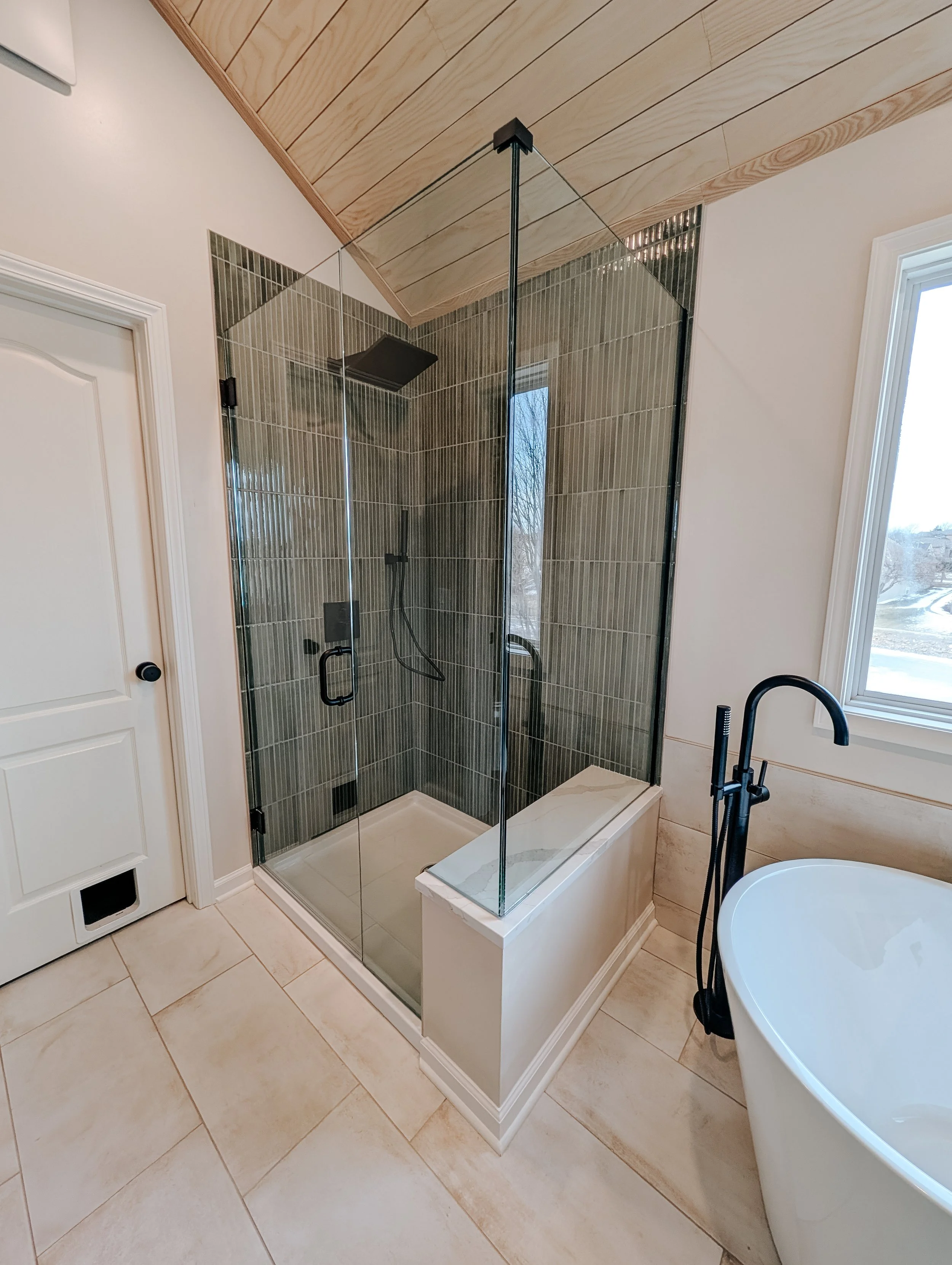 Spa Bathroom Remodel in Lee's Summit with frameless glass shower and freestanding tub