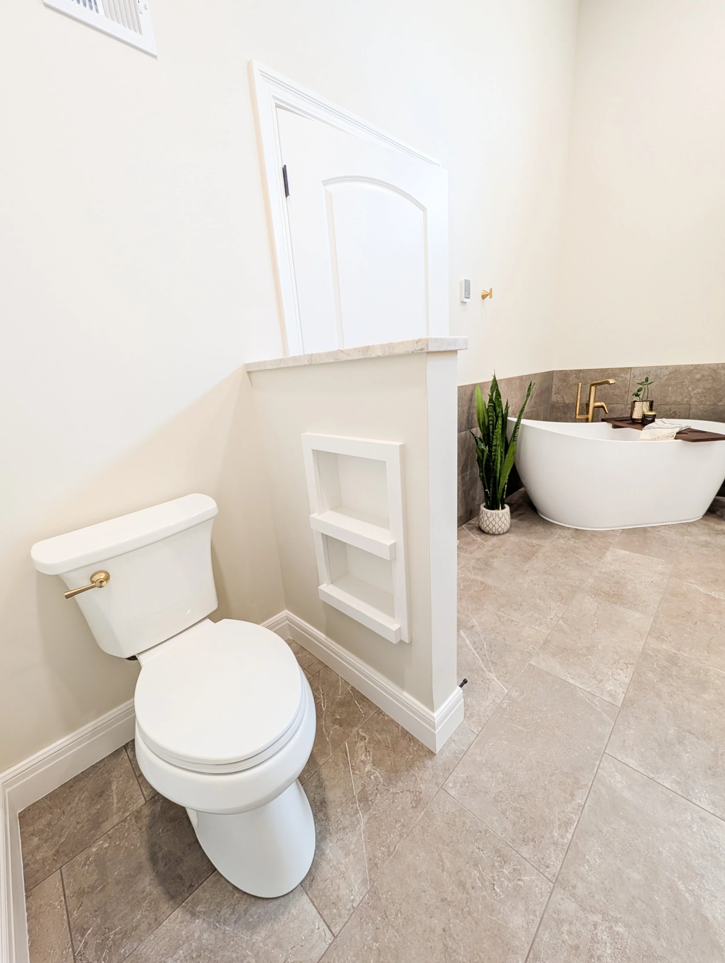Lee's Summit bathroom remodel with water closet niche and freestanding tub