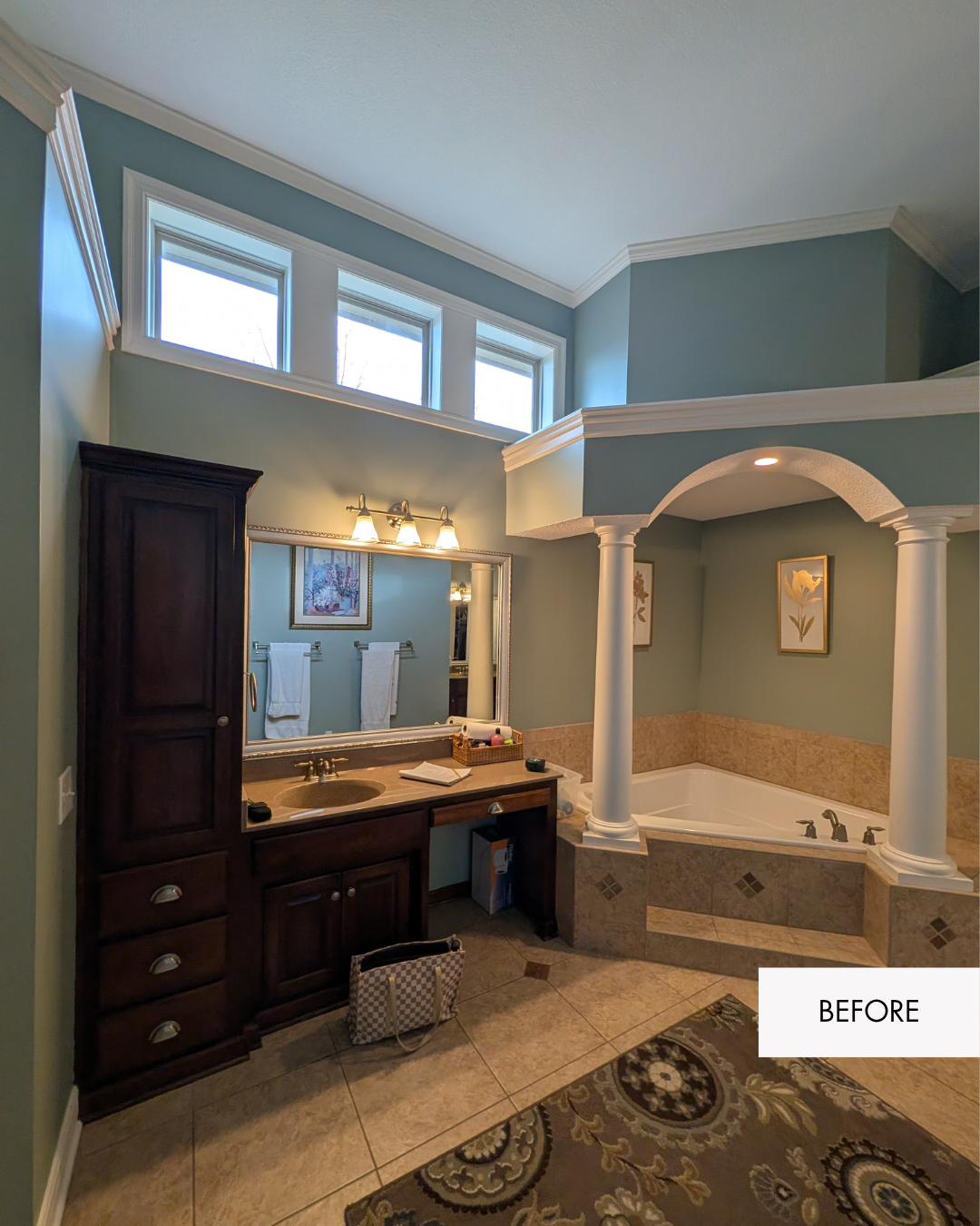 Bathroom before with single vanity and large architectural details around jetted tub