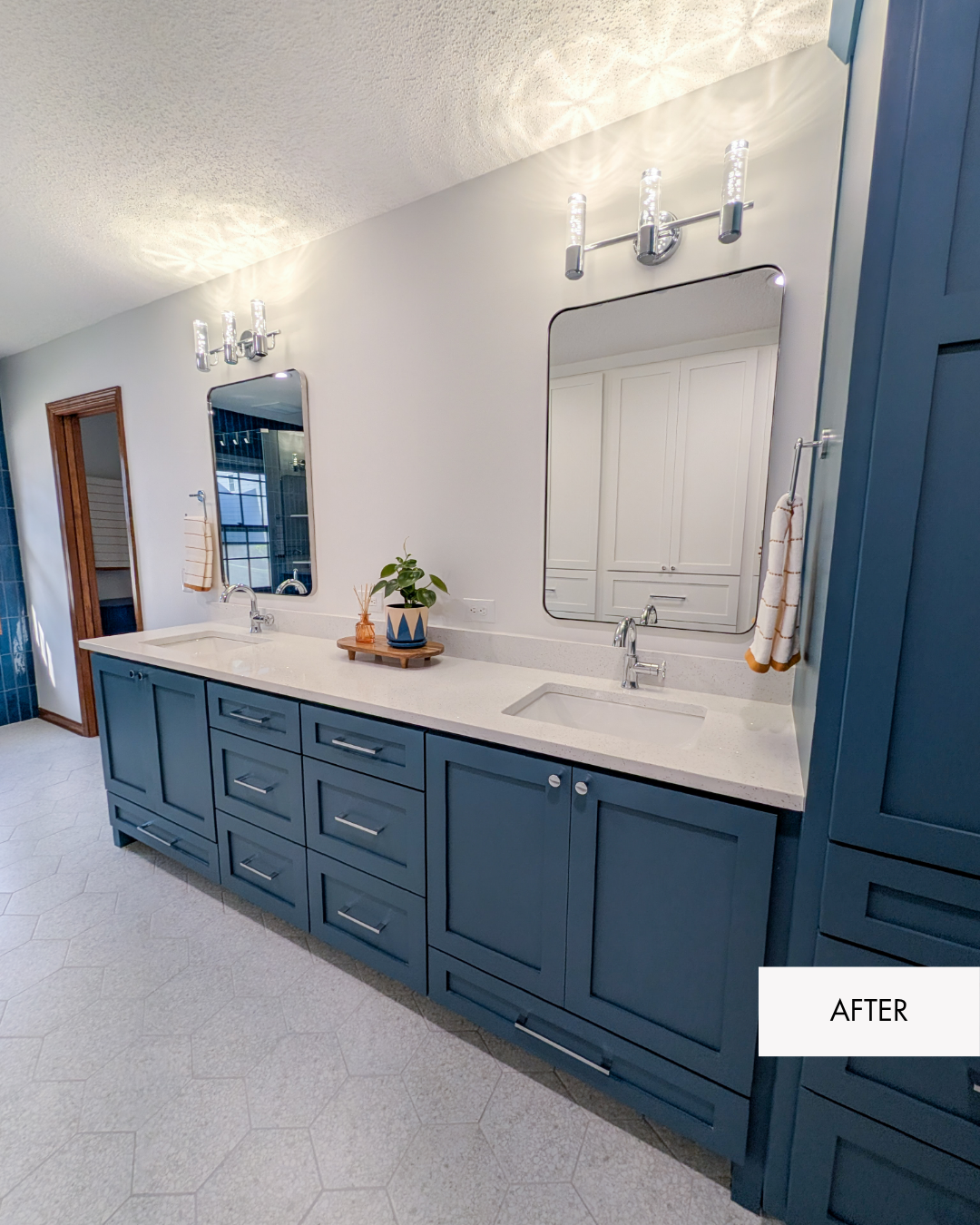 Remodeled Lee's Summit primary bathroom with custom blue cabinetry, updated lighting, new finishes and a more functional layout