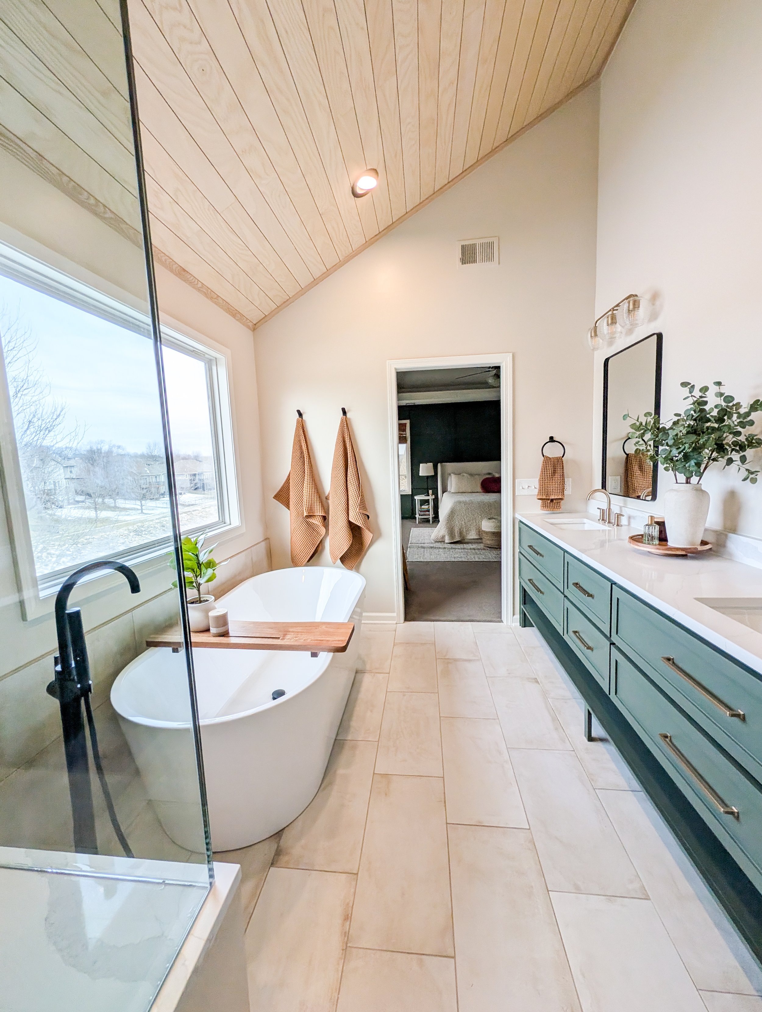 Lee's Summit spa bathroom remodel with freestanding tub and sage green vanity