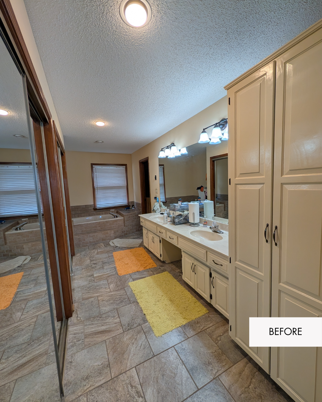 Primary bathroom before remodel with an oversized jetted bathtub and a layout that separated the shower from the main bathroom