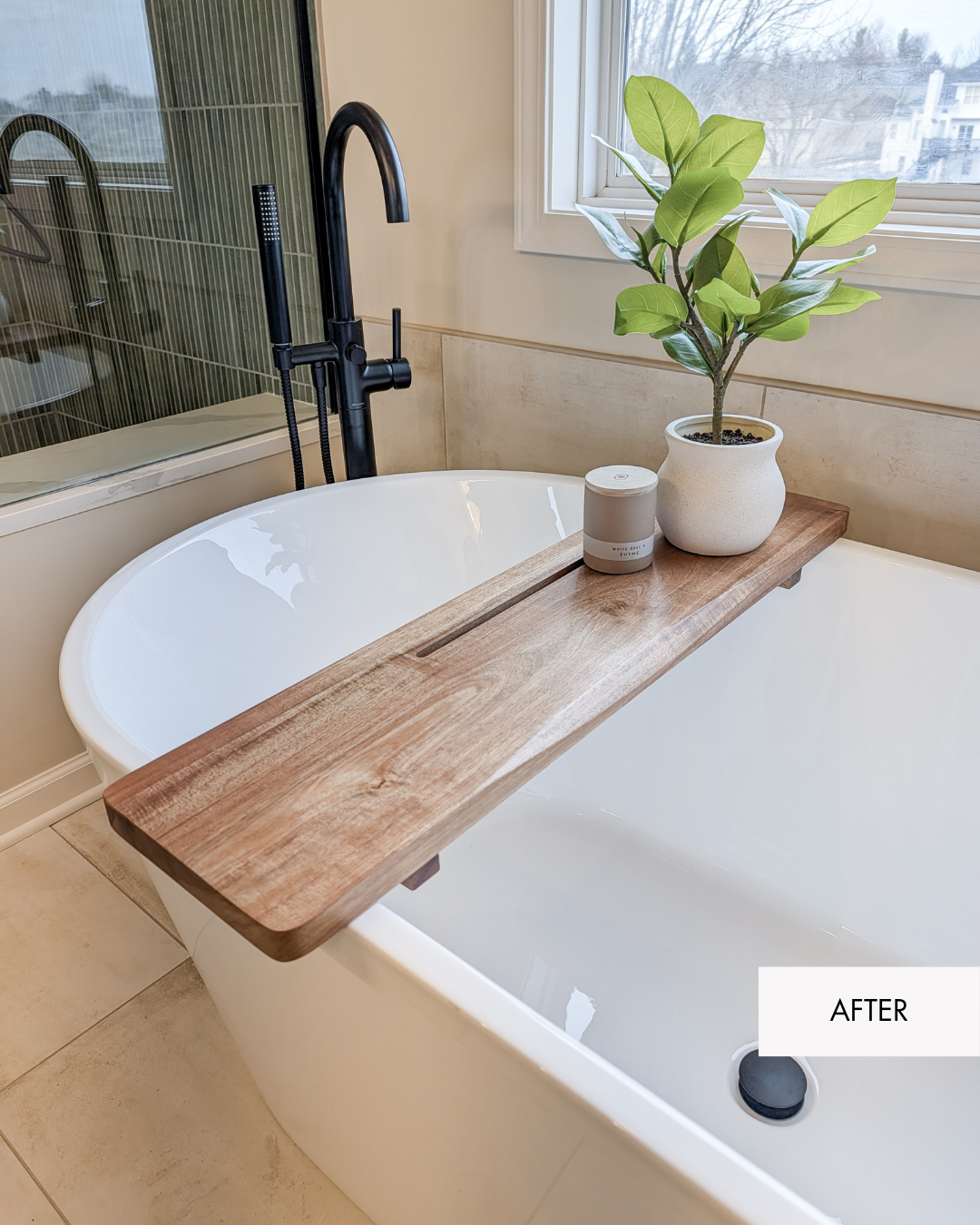 Feature of freestanding tub with neutral tub tray and decorative accents in a Lee's Summit primary bathroom remodel