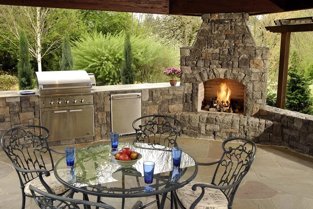 outdoor kitchen with fireplace in happy valley