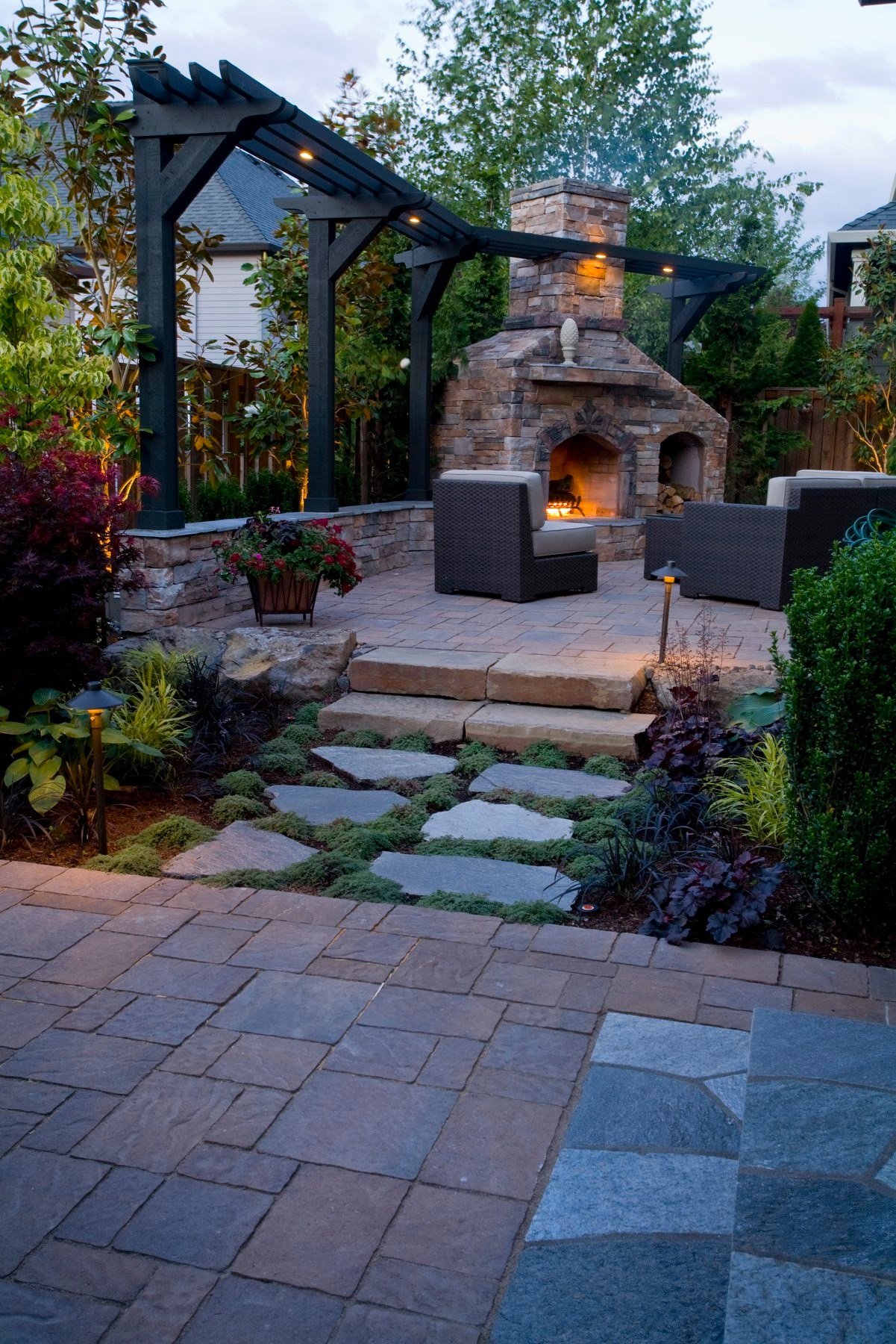 Stunning outdoor fireplace and landscape installation performed by Big Sky Landscaping for a residential landscaping client in Happy Valley, OR.