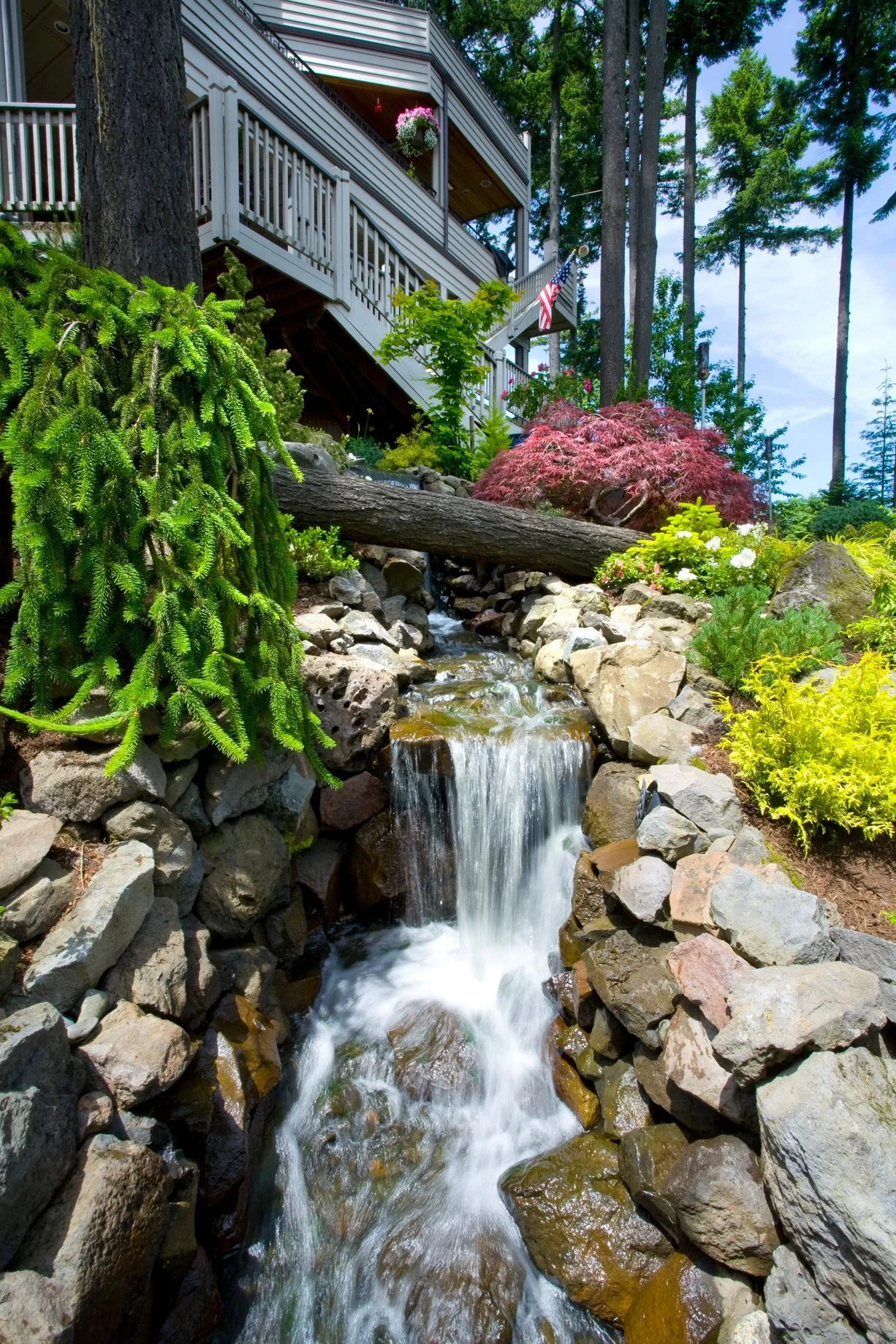 This vibrant Hillsboro garden is brought to life with a professional Hillsboro landscape design, featuring colorful perennials and carefully chosen rockwork.