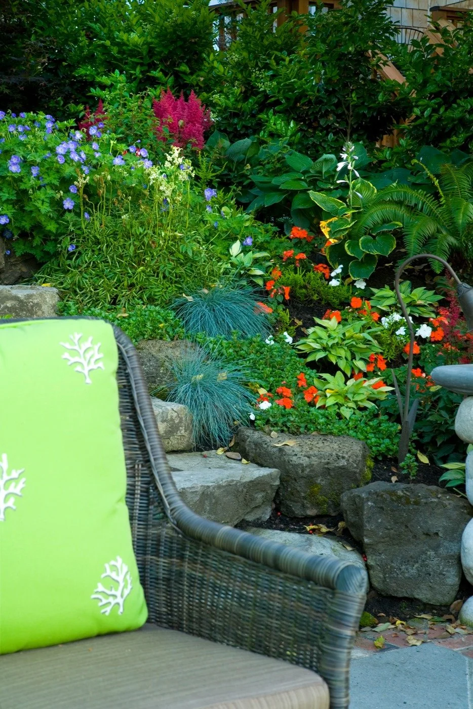 This vibrant Hillsboro garden is brought to life with a professional Hillsboro landscape design, featuring colorful perennials and carefully chosen rockwork.