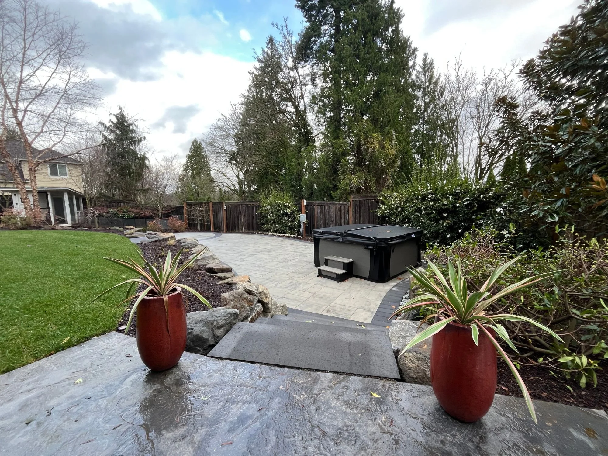 A West Linn patio installation performed by Big Sky Landscaping using stone blocks and mixed concrete.