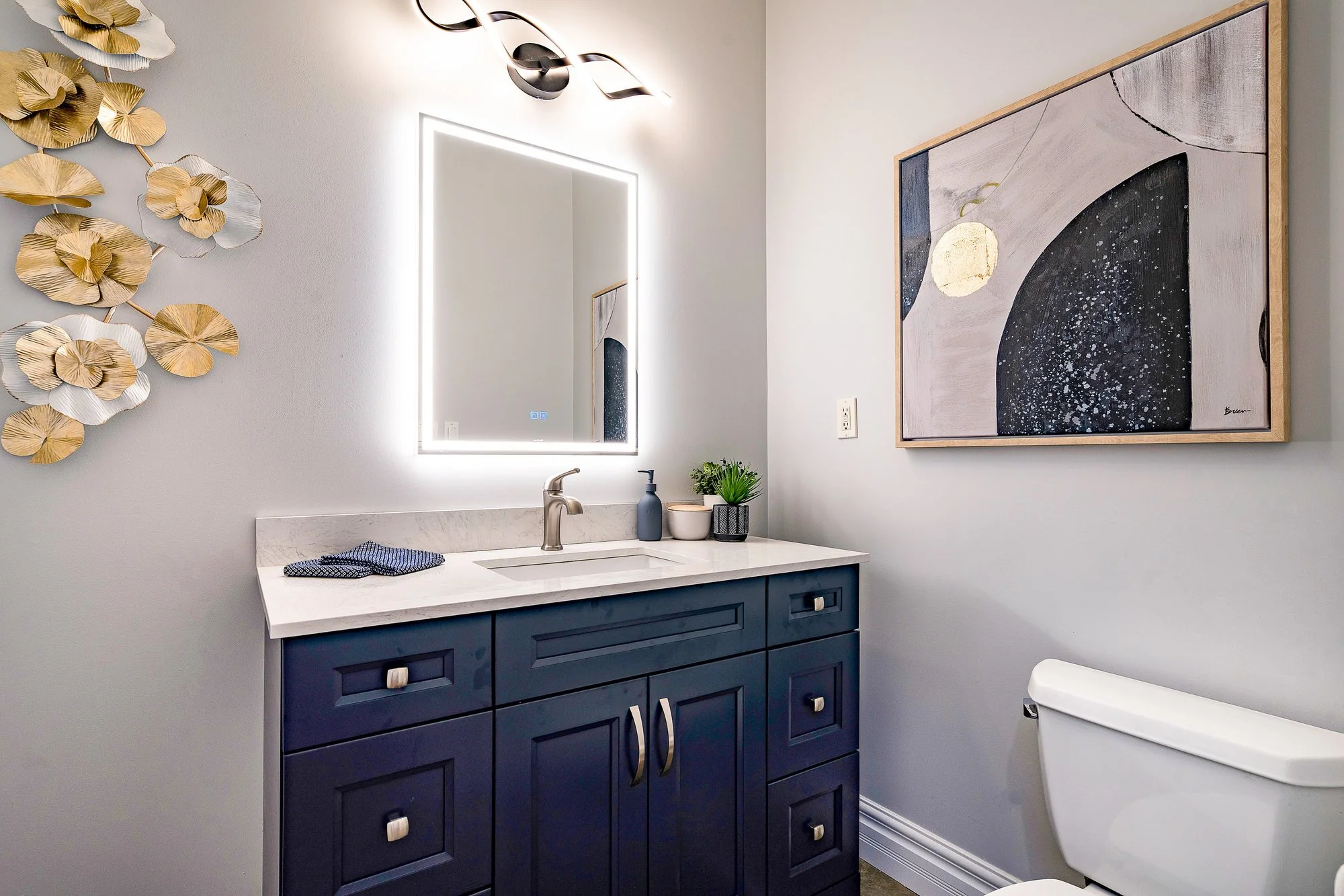 Vintage-style hanging light bulbs with exposed filaments against a brick wall background.