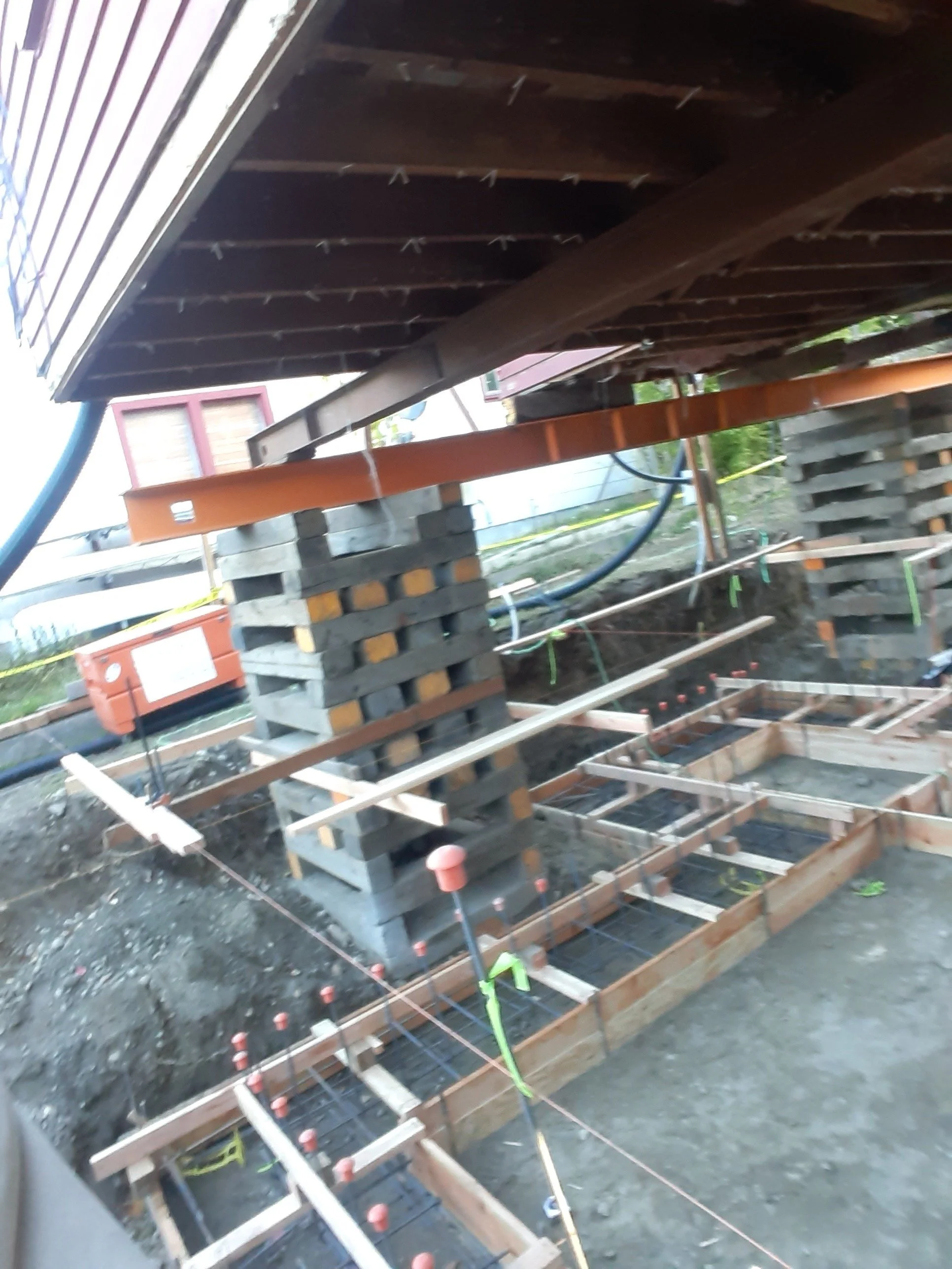 House lifted for new foundation on whole house remodel and victorian restoration/modification in Port Townsend