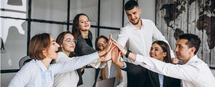 a business team giving a group high 5