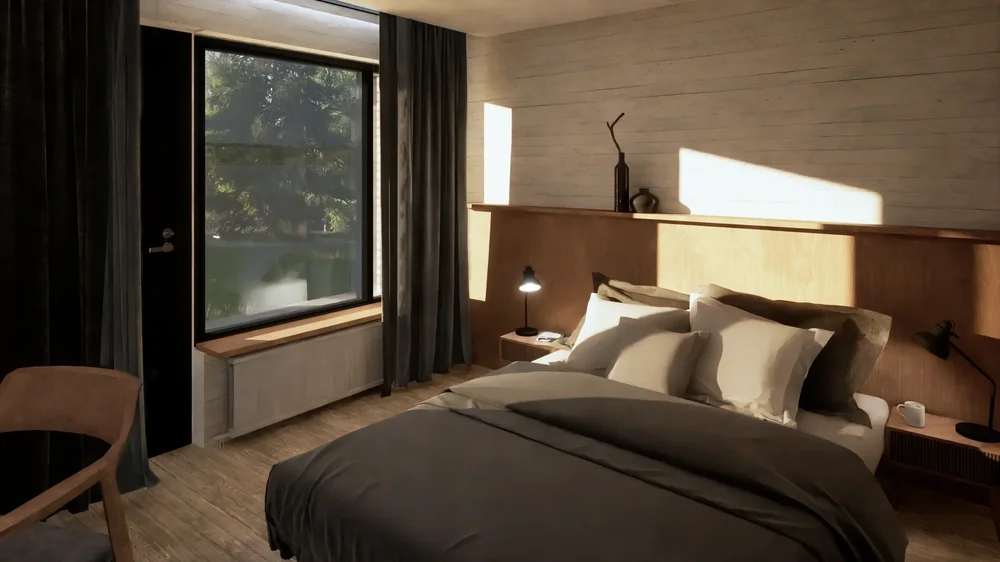 Bedroom with sloped ceiling, navy bedding, and a rectangular window