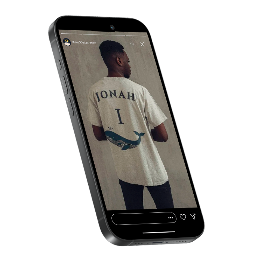 A person wearing a white t-shirt with the name 'Jonah' and a whale graphic on the back, standing and looking to the side, being displayed on a smartphone screen.