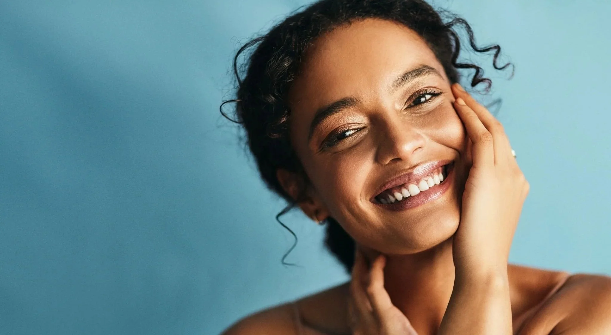 Smiling woman with healthy skin