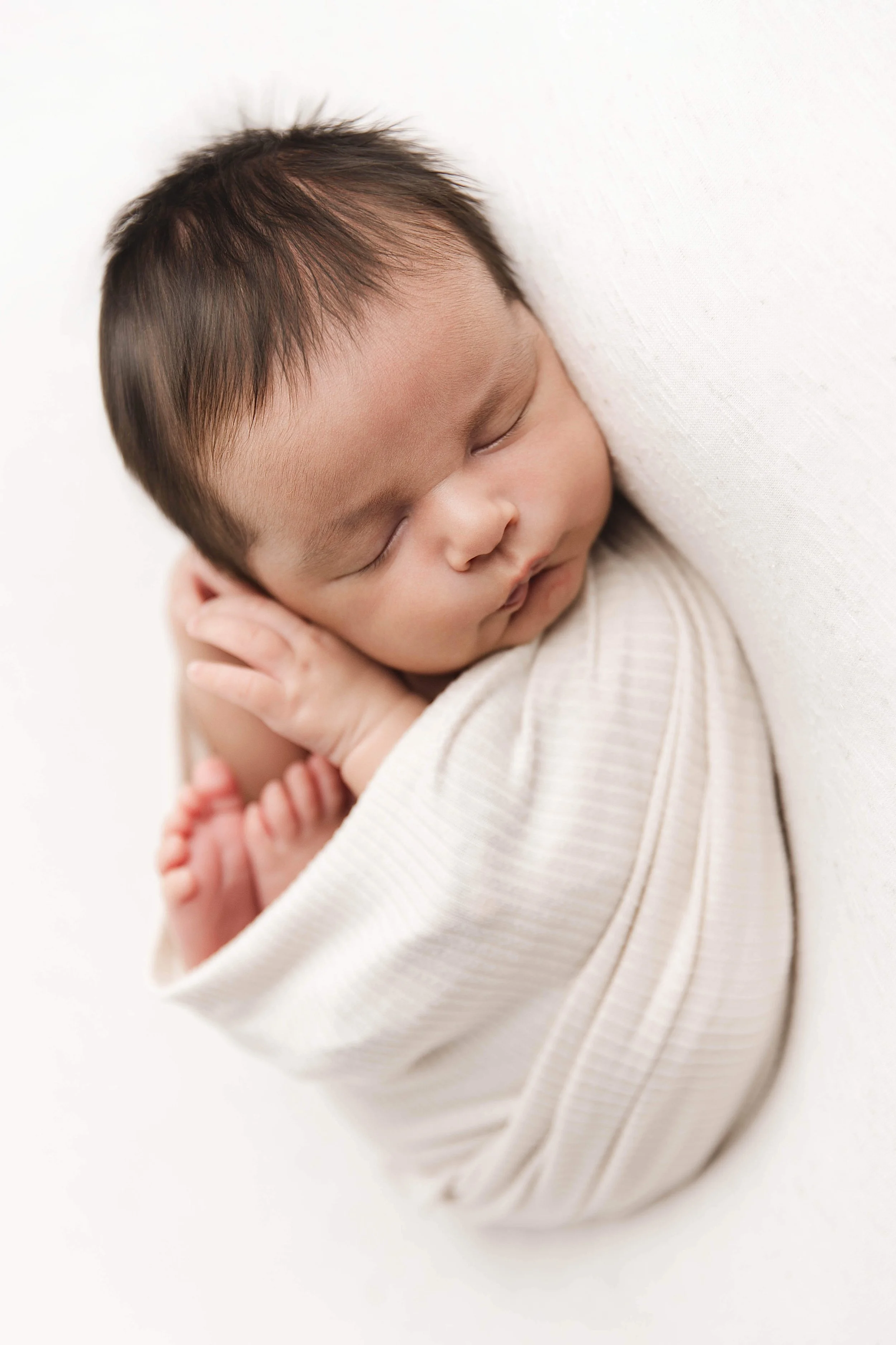neutral baby wrapped photo